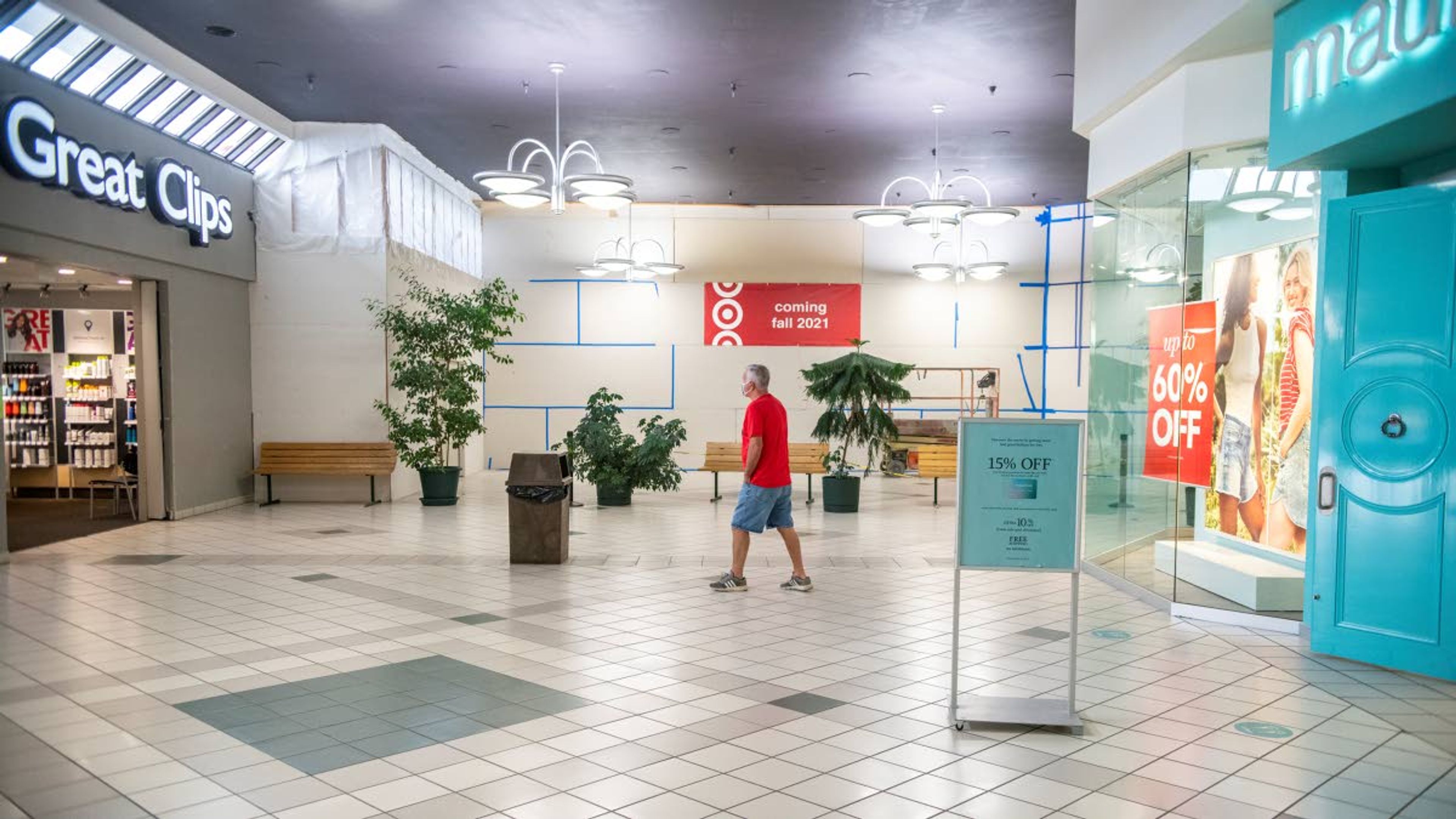 Zach Wilkinson/Daily NewsA man walks underneath a sign indicating Target’s fall 2021 opening on the west end of the Palouse Mall on Thursday afternoon in Moscow.