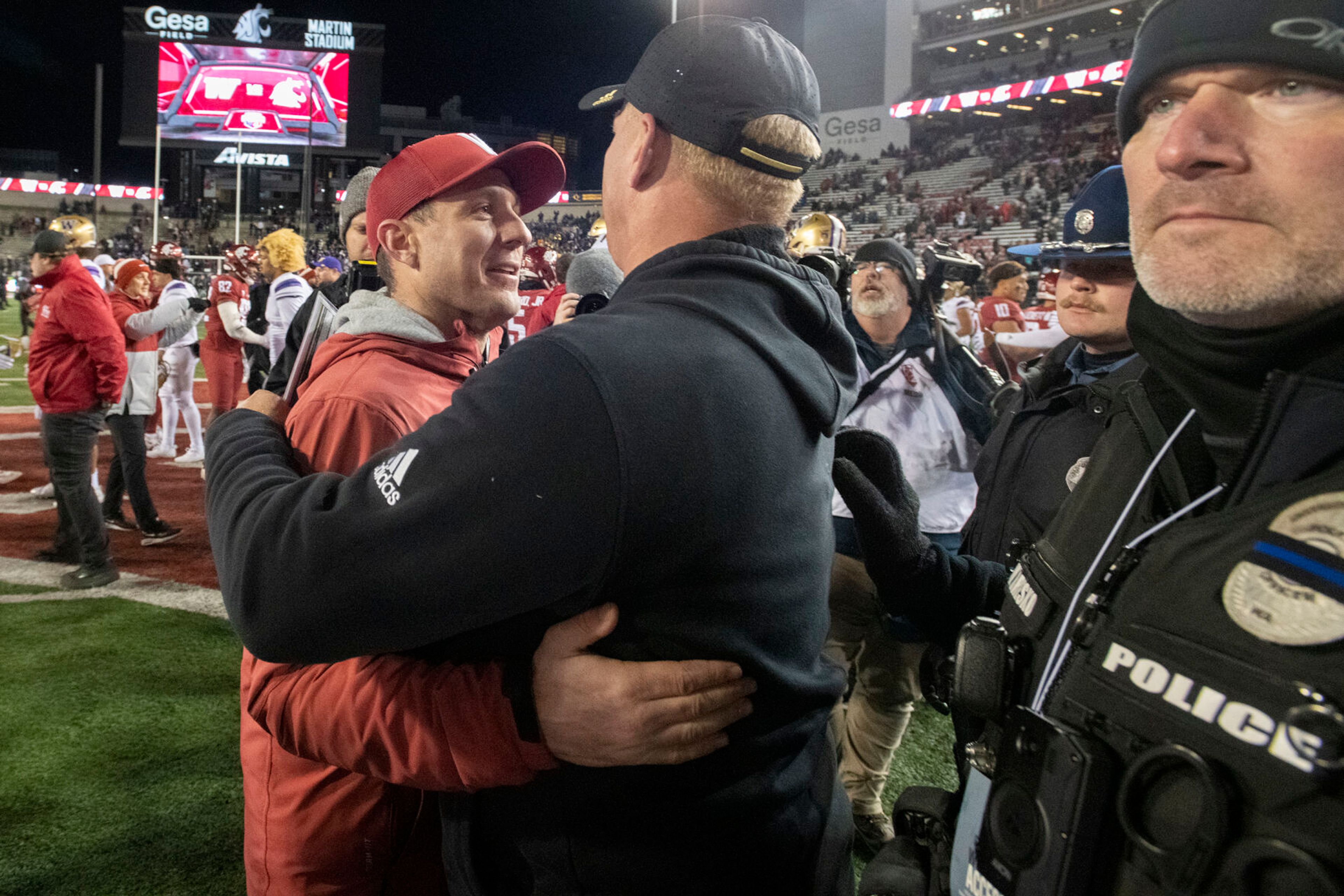 Washington State coach Jake Dickert shakes hands with Washington coach Kalen DeBoer after the Nov. 26 Apple Cup at Gesa Field in Pullman. The Cougars will play Fresno State in the Jimmy Kimmel LA Bowl on Dec. 17.