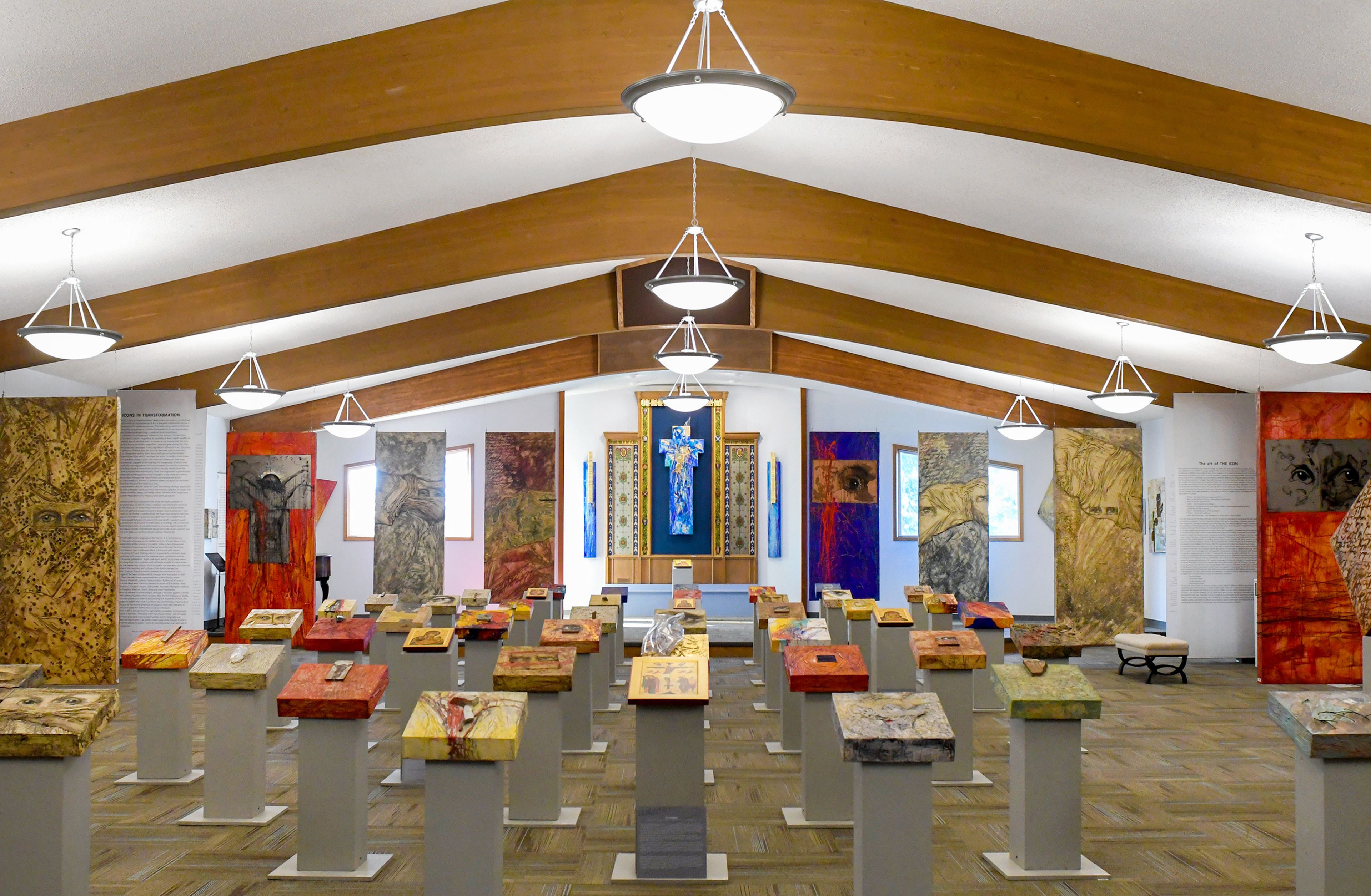 Pieces from Ludmila Pawlowskas traveling exhibit, Icons in Transformation, fill a hall Thursday at St. James Episcopal Church in Pullman.