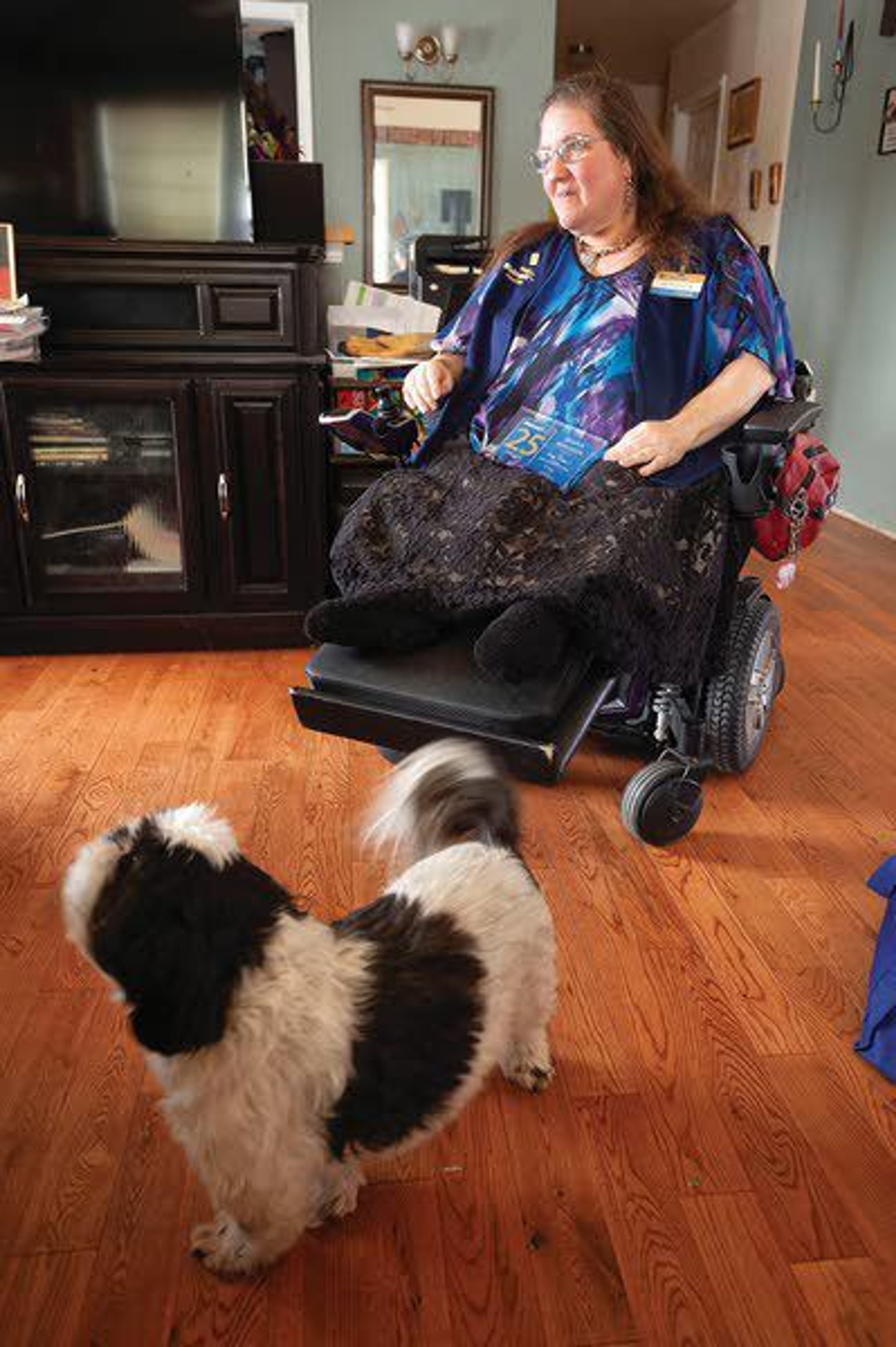 Jessica Bergman talks about her job as a greeter at Walmart on Tuesday at her home in Moscow.