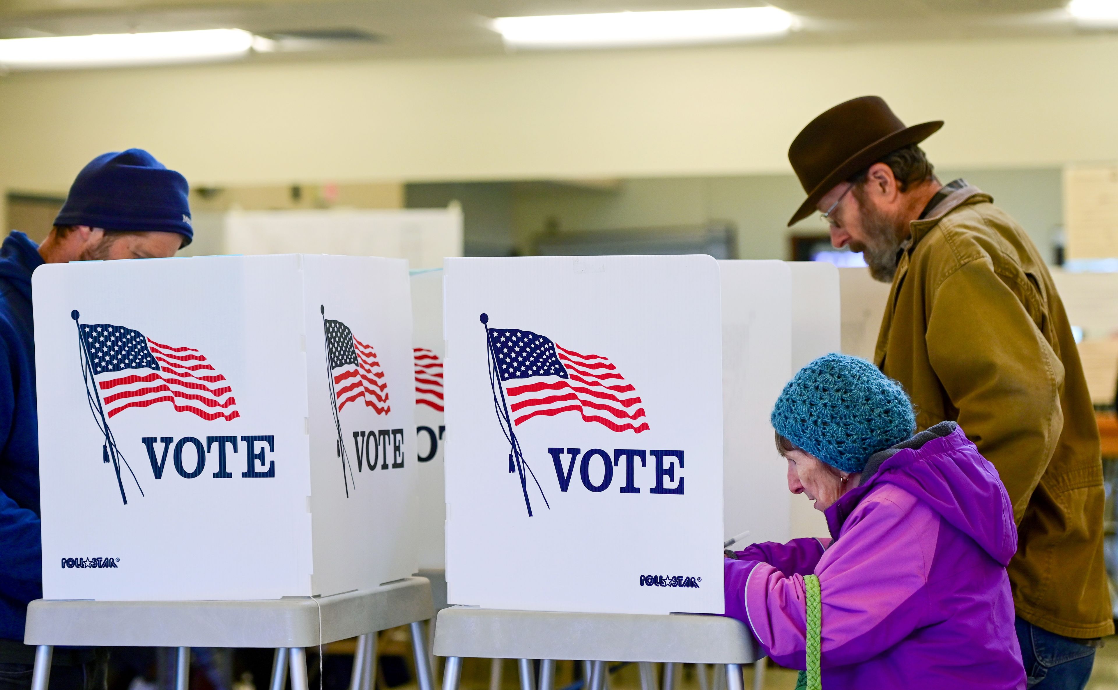 Local voters, including Annette Miller, front, fill out their ballots at the Hamilton Indoor Recreation Center in Moscow on Election Day.