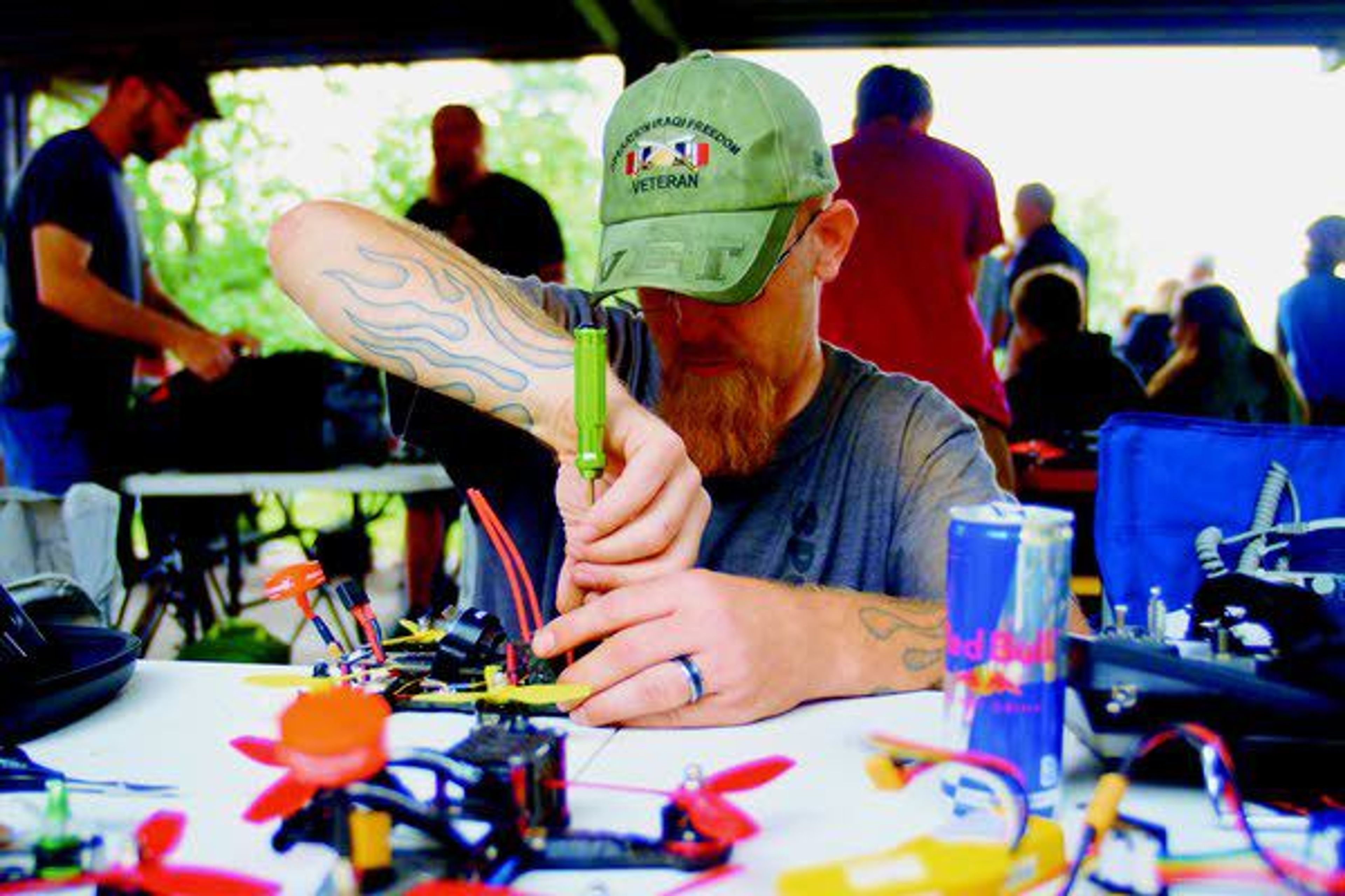 Brad Gilmore works on a racing drone Saturday morning ahead of heat at Pullman's Kruegel Park.