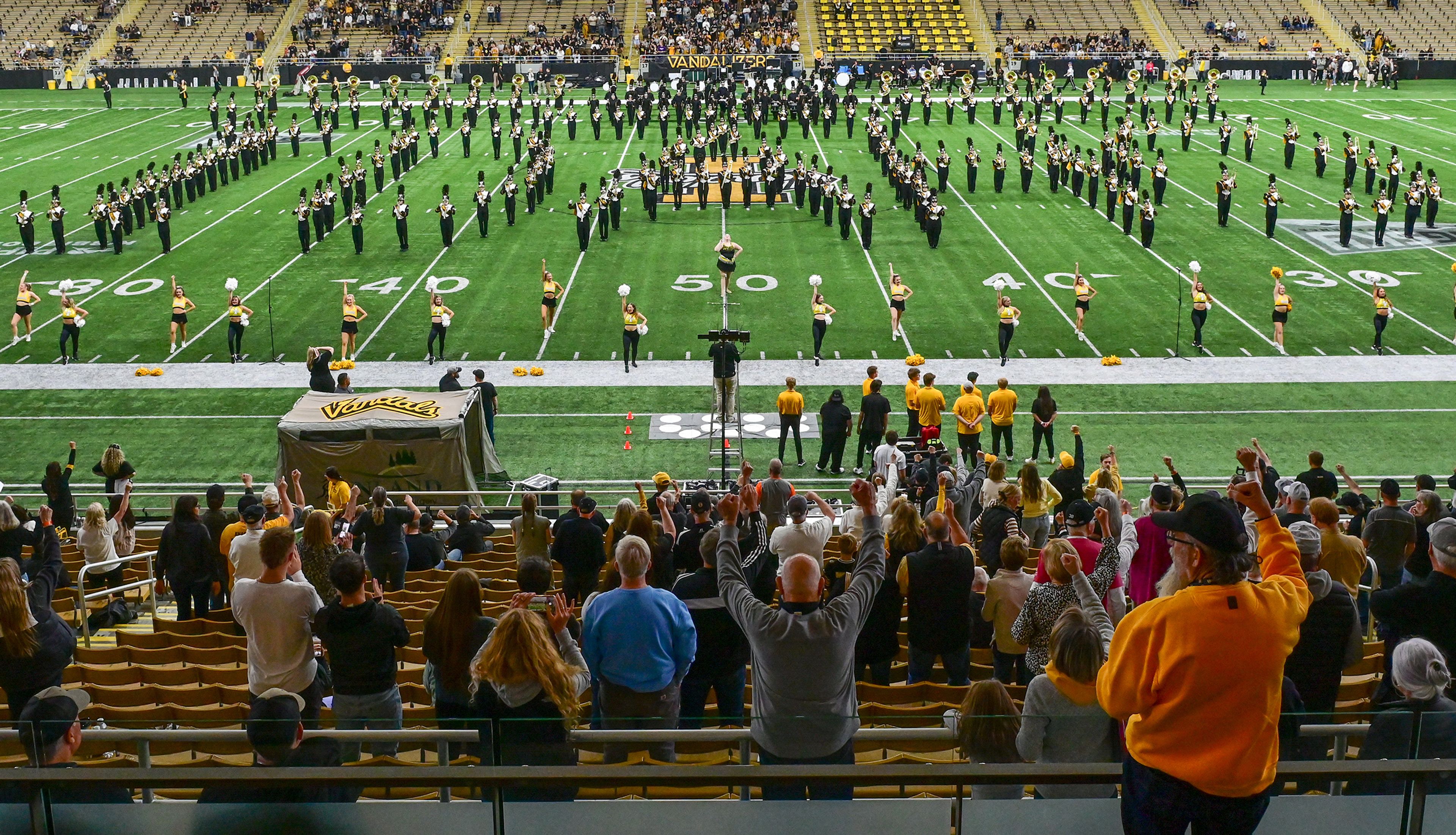 Idaho's Vandal Marching Band spells out Idaho on the field while playing a fight song Saturday before a game against Cal Poly at the P1FCU Kibbie Dome in Moscow.,