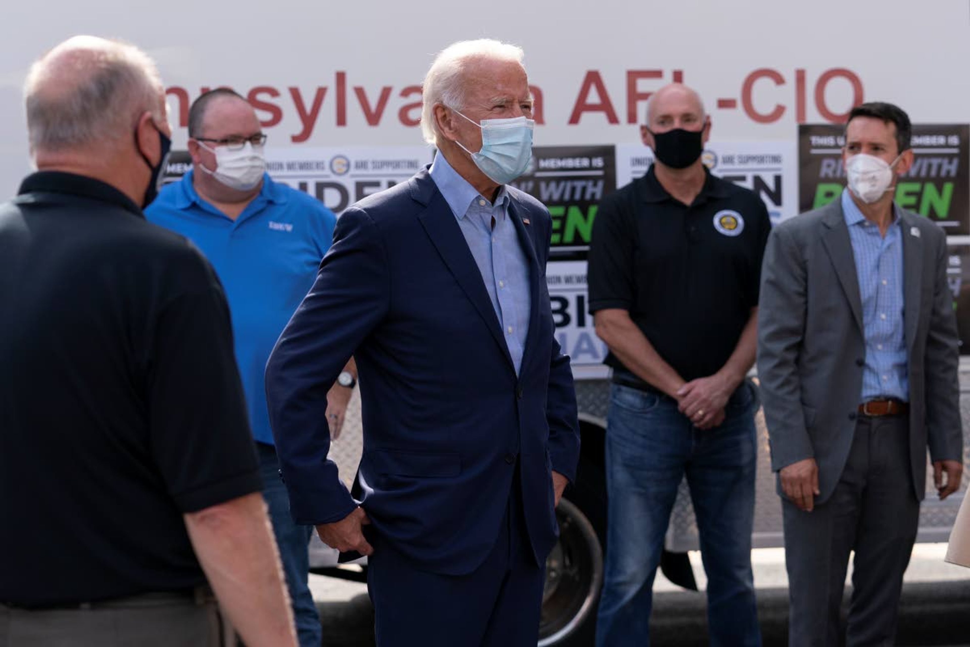 Associated PressDemocratic presidential candidate former Vice President Joe Biden talks with union leaders after taking photographs Monday outside the AFL-CIO headquarters in Harrisburg, Pa.