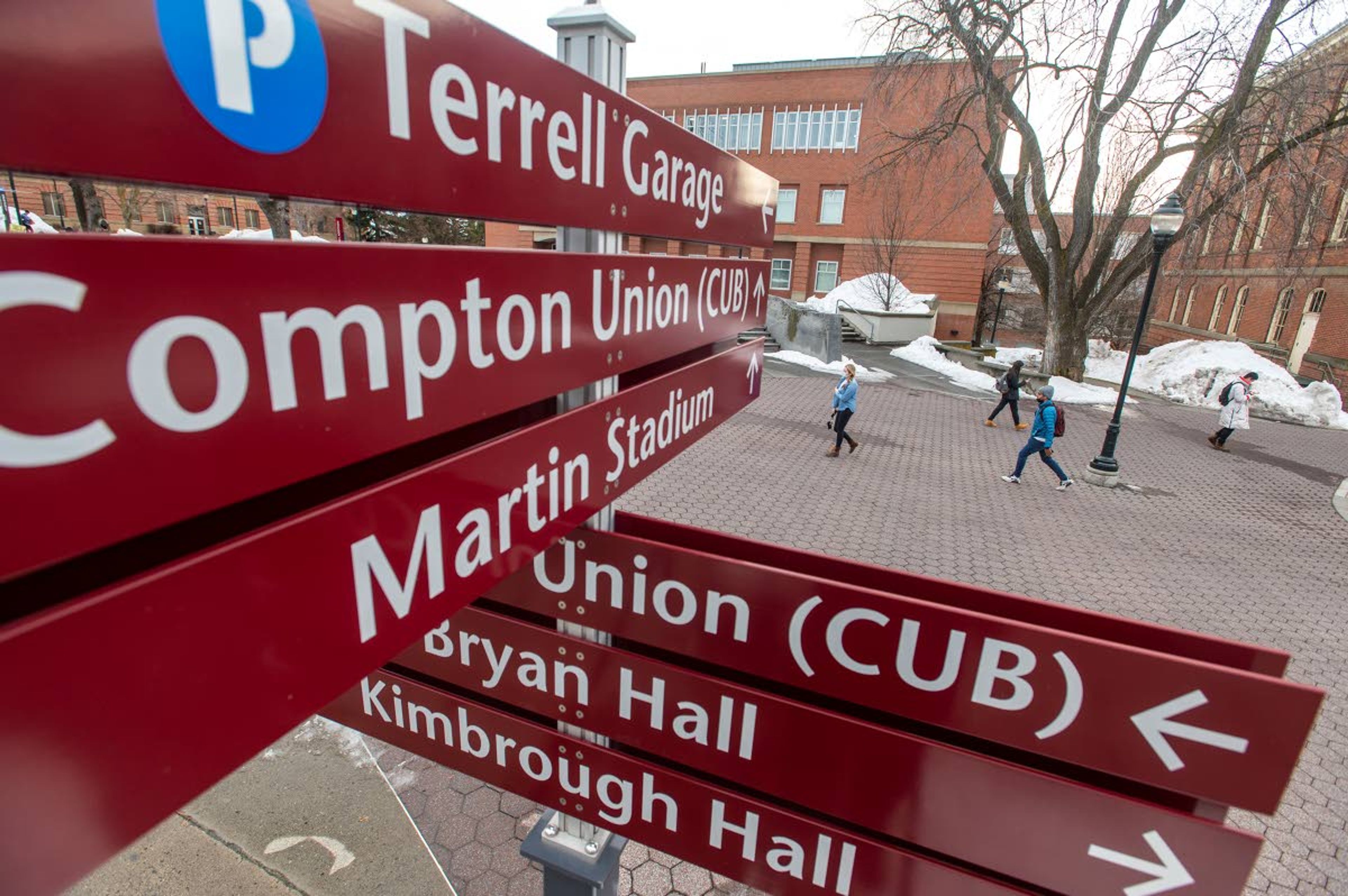 Washington State University students walk along campus Wednesday as spring classes begin two days later than expected in Pullman.