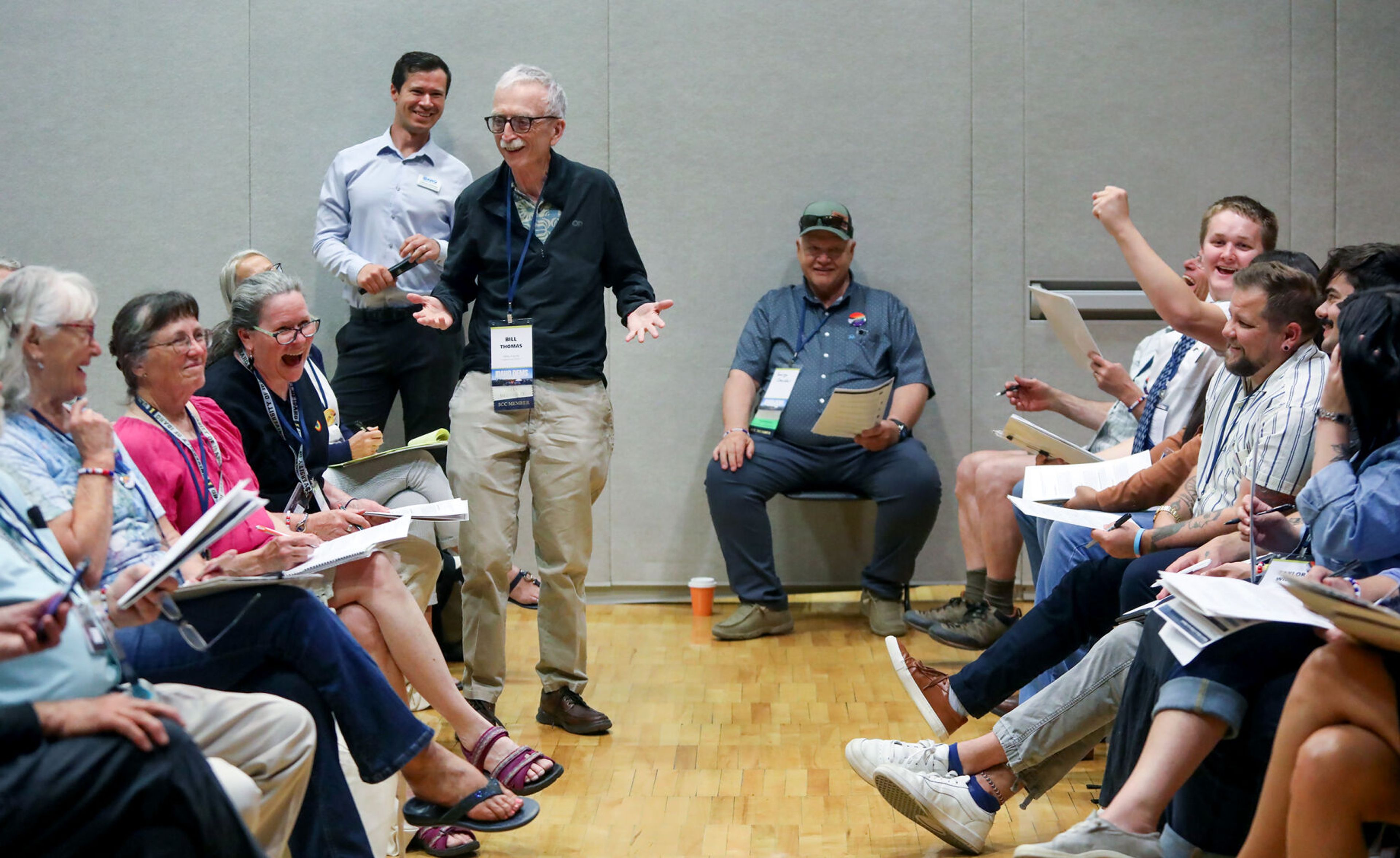 Those gathered for the Idaho Democratic Convention react to a joke from Bill Thomas, of Valley County, during the Platform Hearing on Saturday in Moscow.