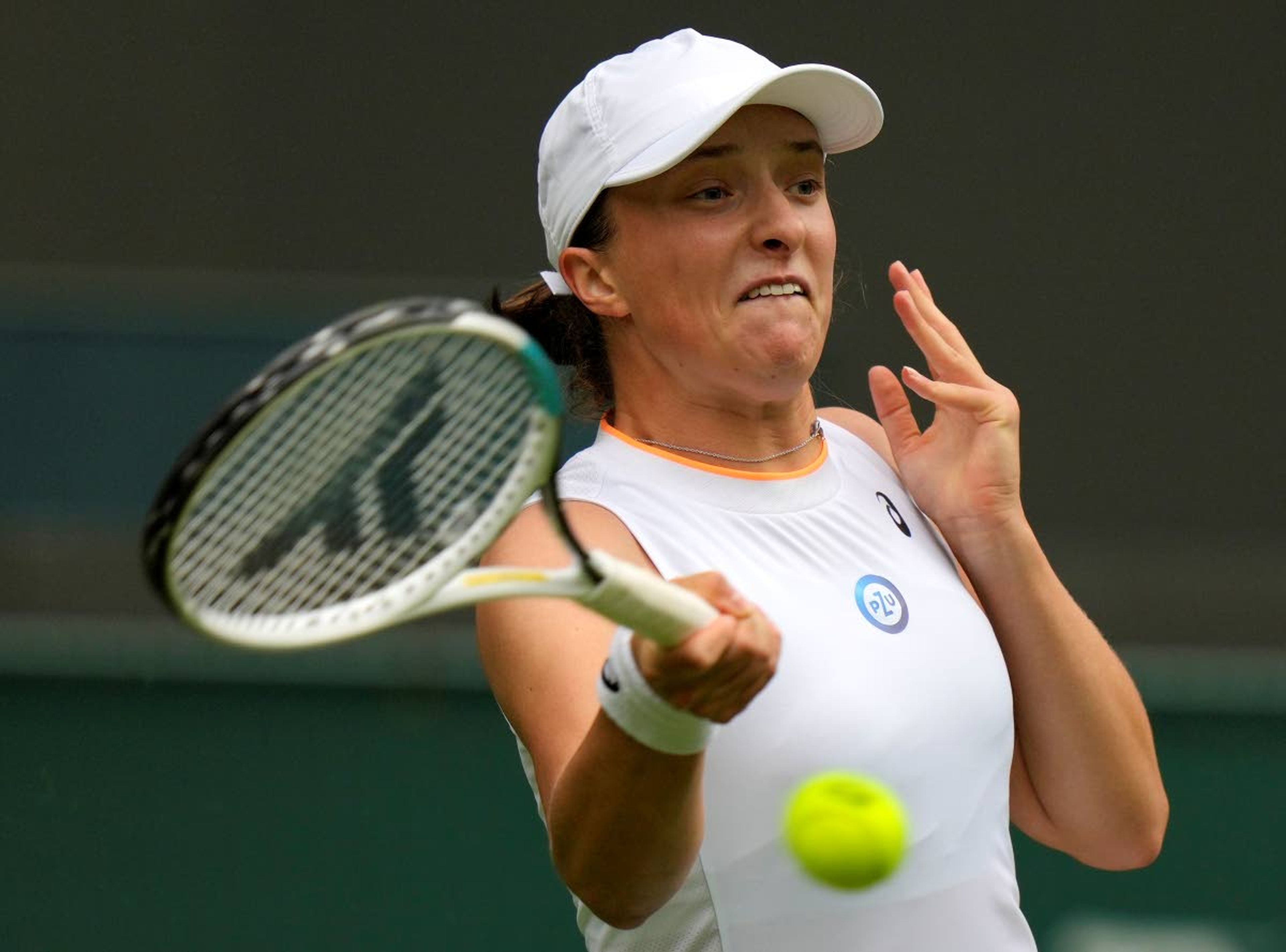 Poland's Iga Swiatek returns the ball to Taiwan's Su-Wei Hsieh during the women's singles match on day one of the Wimbledon Tennis Championships in London, Monday June 28, 2021. (AP Photo/Alastair Grant)