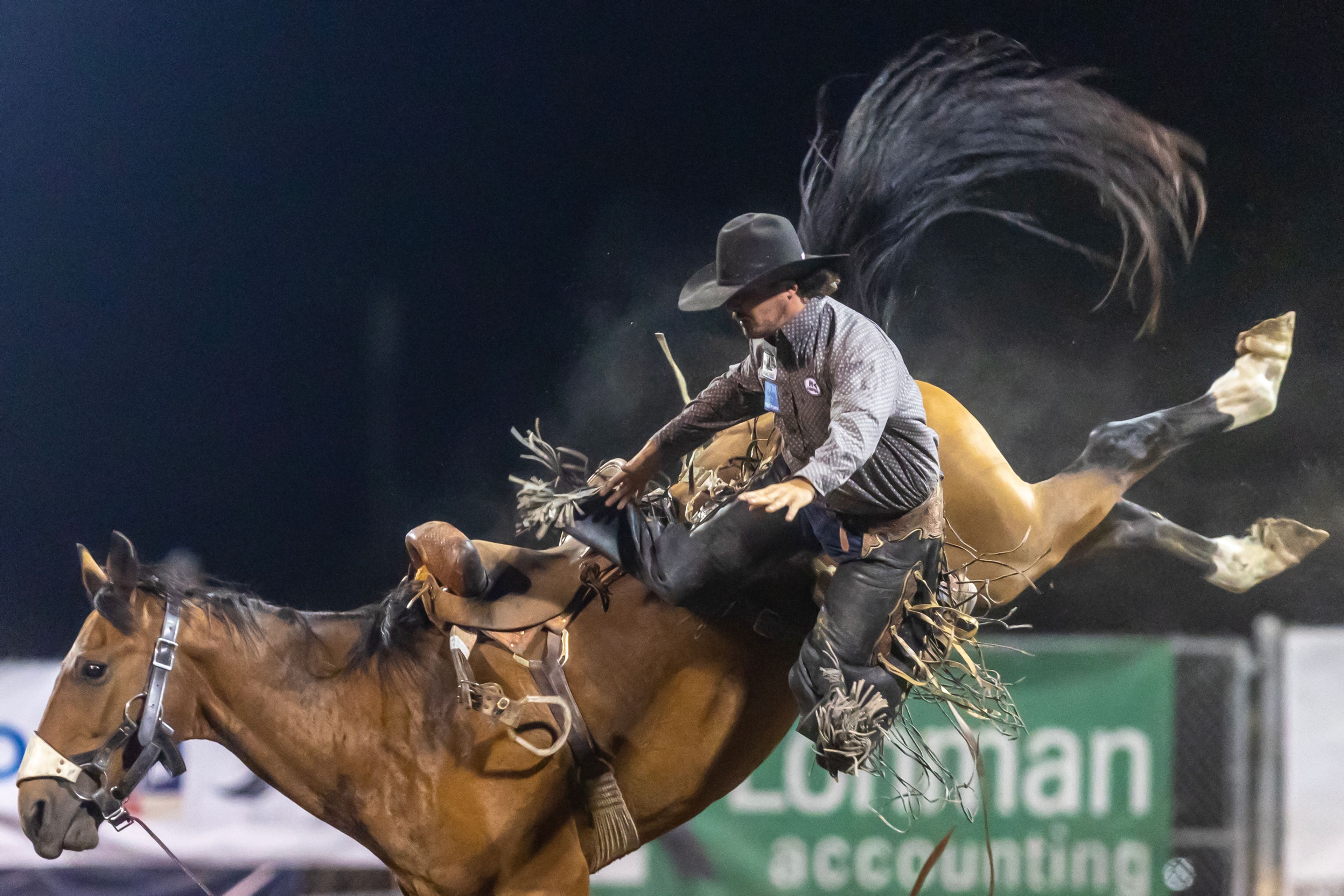 Jake Clark is thrown from Outclassed in the saddle bronc competition on night 3 Friday at the Lewiston Roundup.