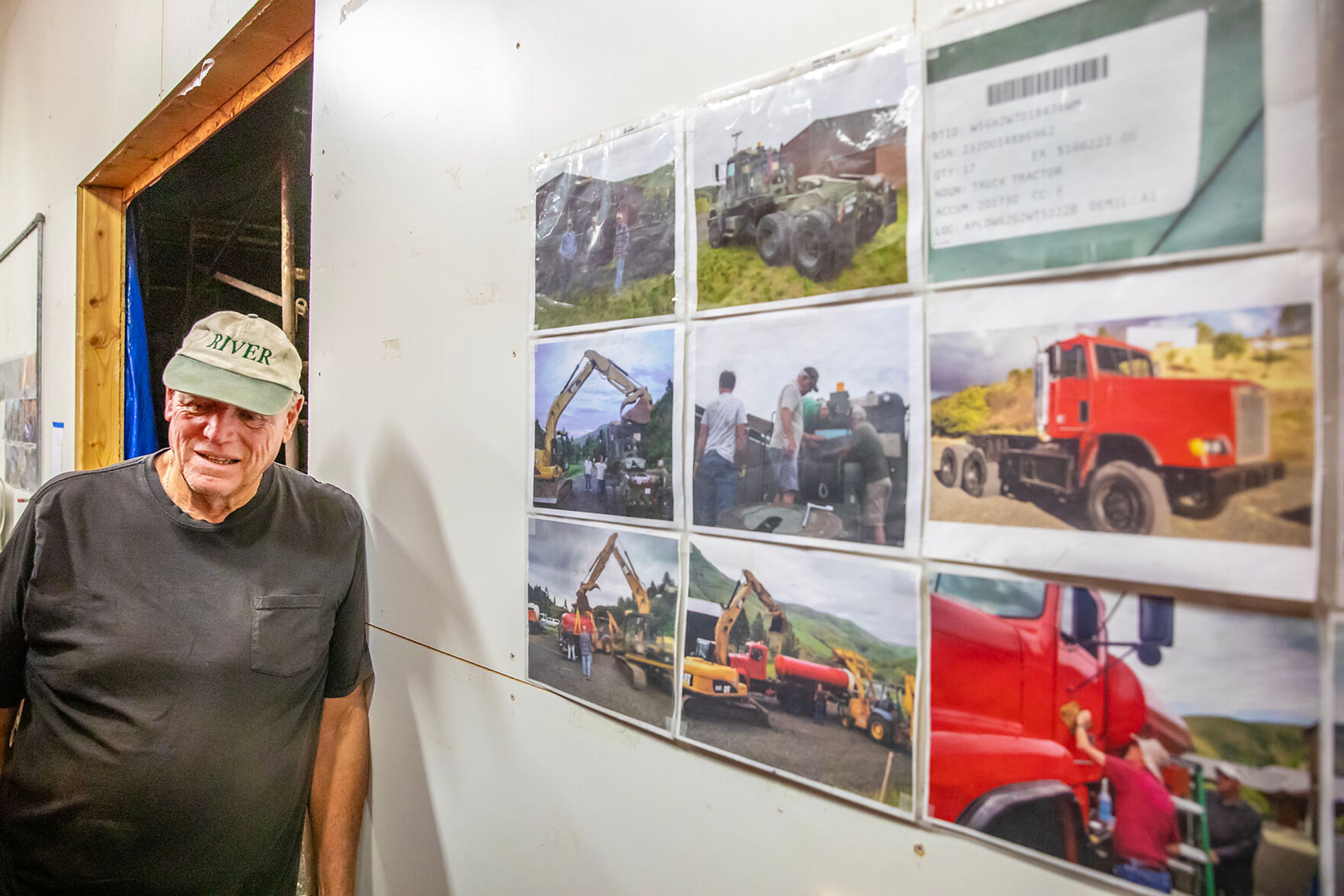 LuVerne Grussing leans against the wall next to pictures of one of their trucks Friday at the Arrow Junction Fire Protection District.