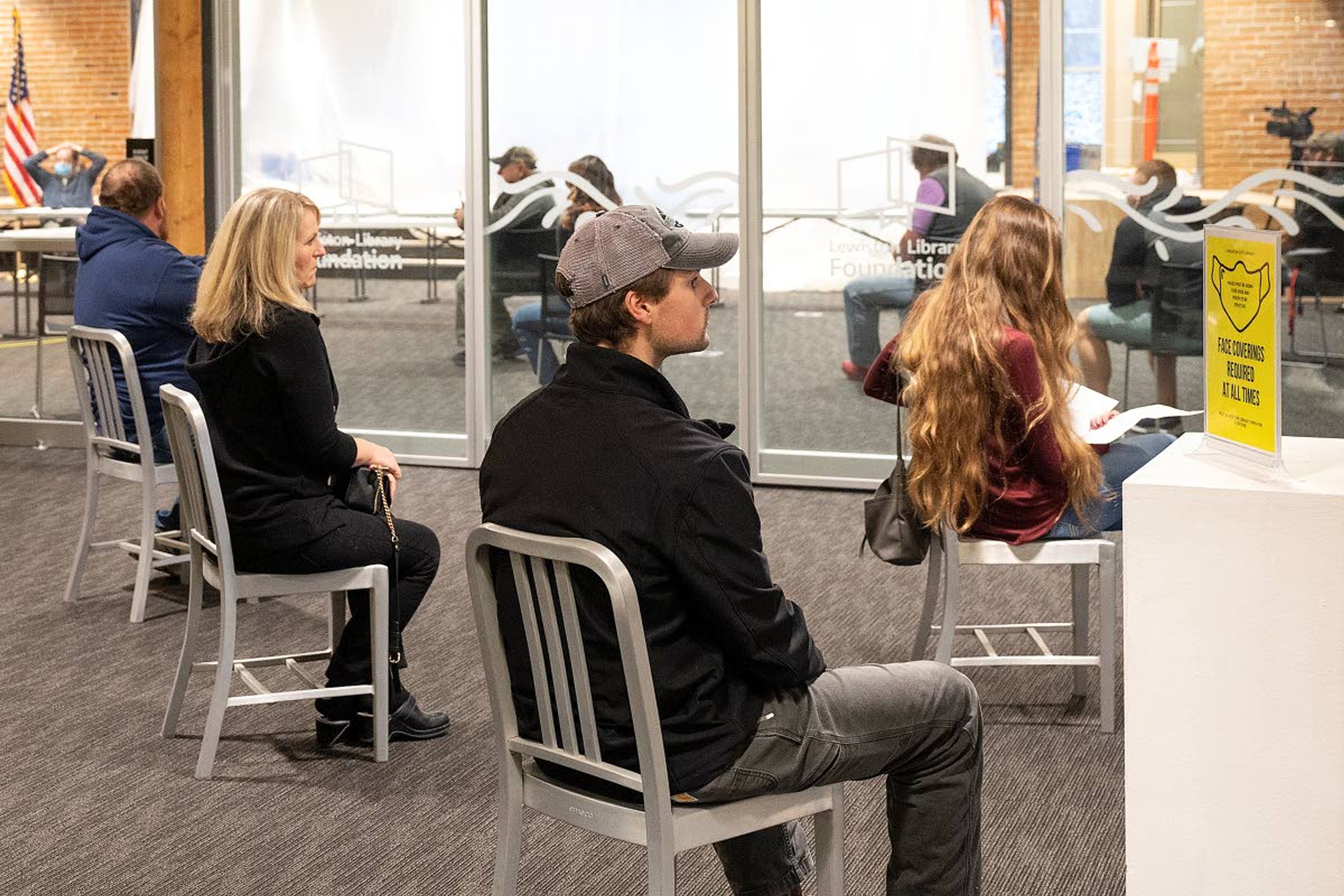 People wait to speak in an overflow room at the Lewiston City Library during a special meeting of the Lewiston City Council on Thursday afternoon. Dozens of people spoke publicly to the city councilors about being against a mask mandate.