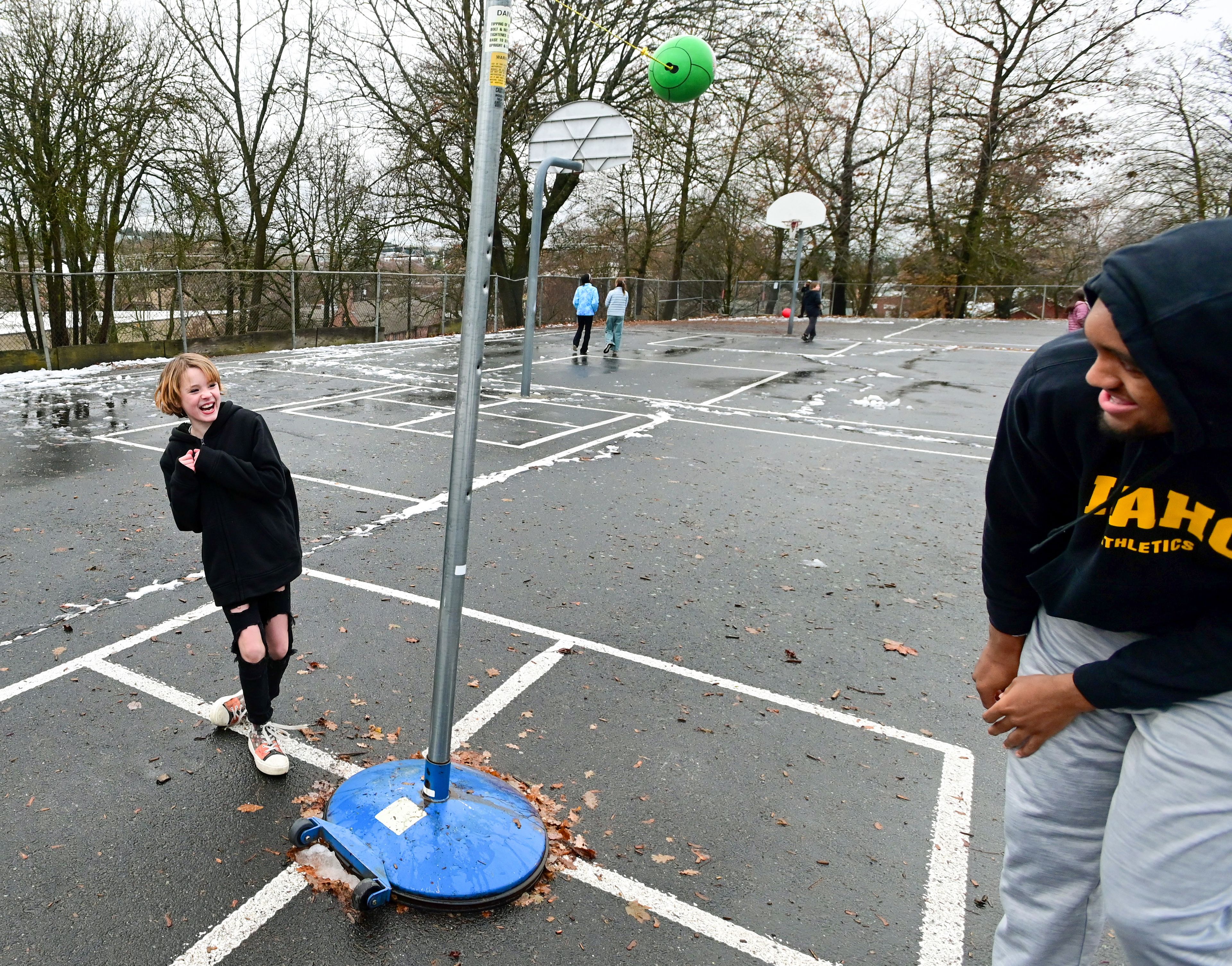 Fifth grader Sam M. plays tetherball with Idaho Vandal Terren Frank during recess at John Russell Elementary School in Moscow on Monday. The Vandals visit with students a few times each month during lunch and recess as mentors.