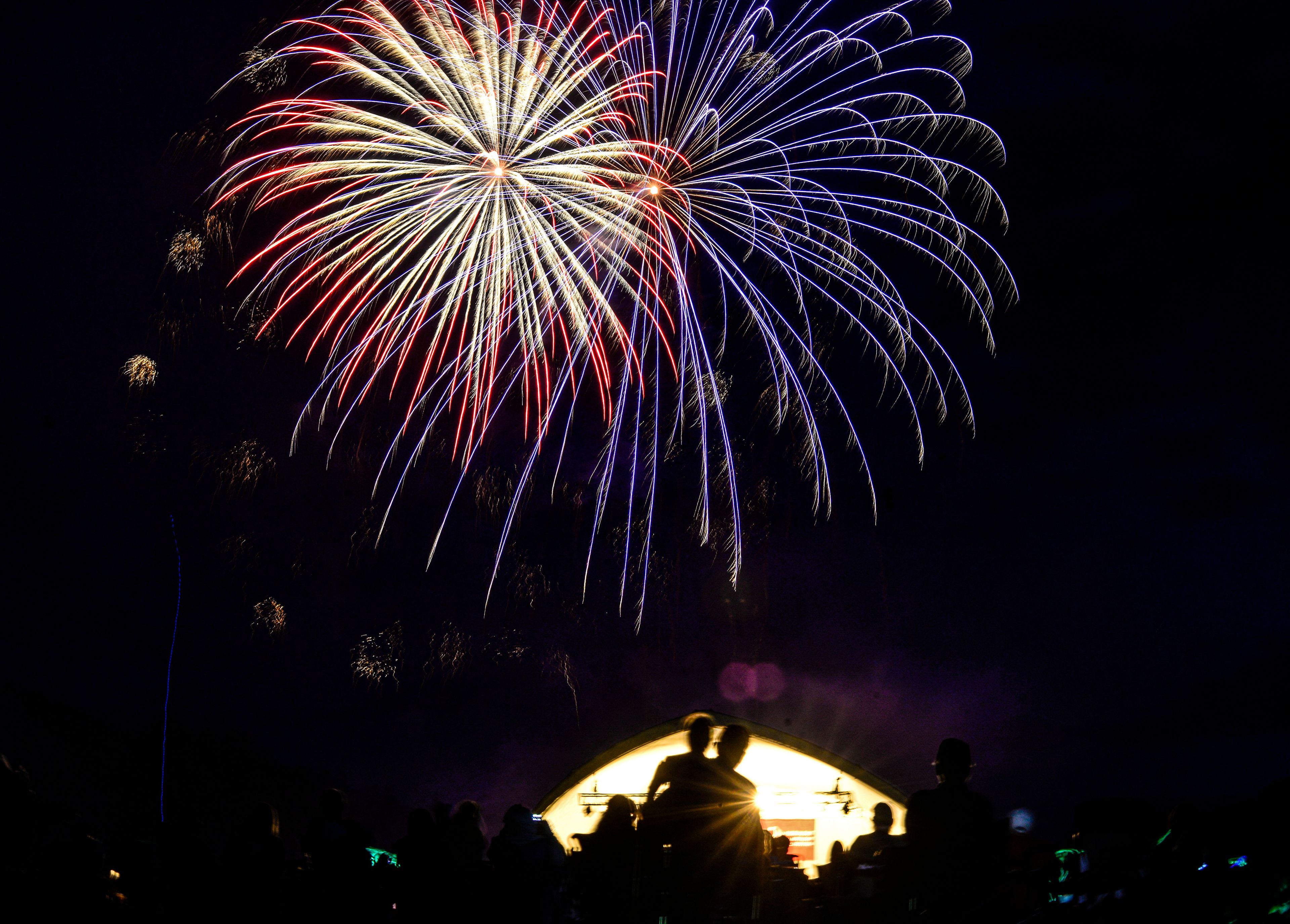 Fireworks fill the sky near the conclusion of the Vermont Symphony Orchestra show at Grafton Pond, in Grafton, Vt., on Sunday, July 3, 2022. Grafton community members raised the money needed to purchase the fireworks needed for the show. (Kristopher Radder/The Brattleboro Reformer via AP)