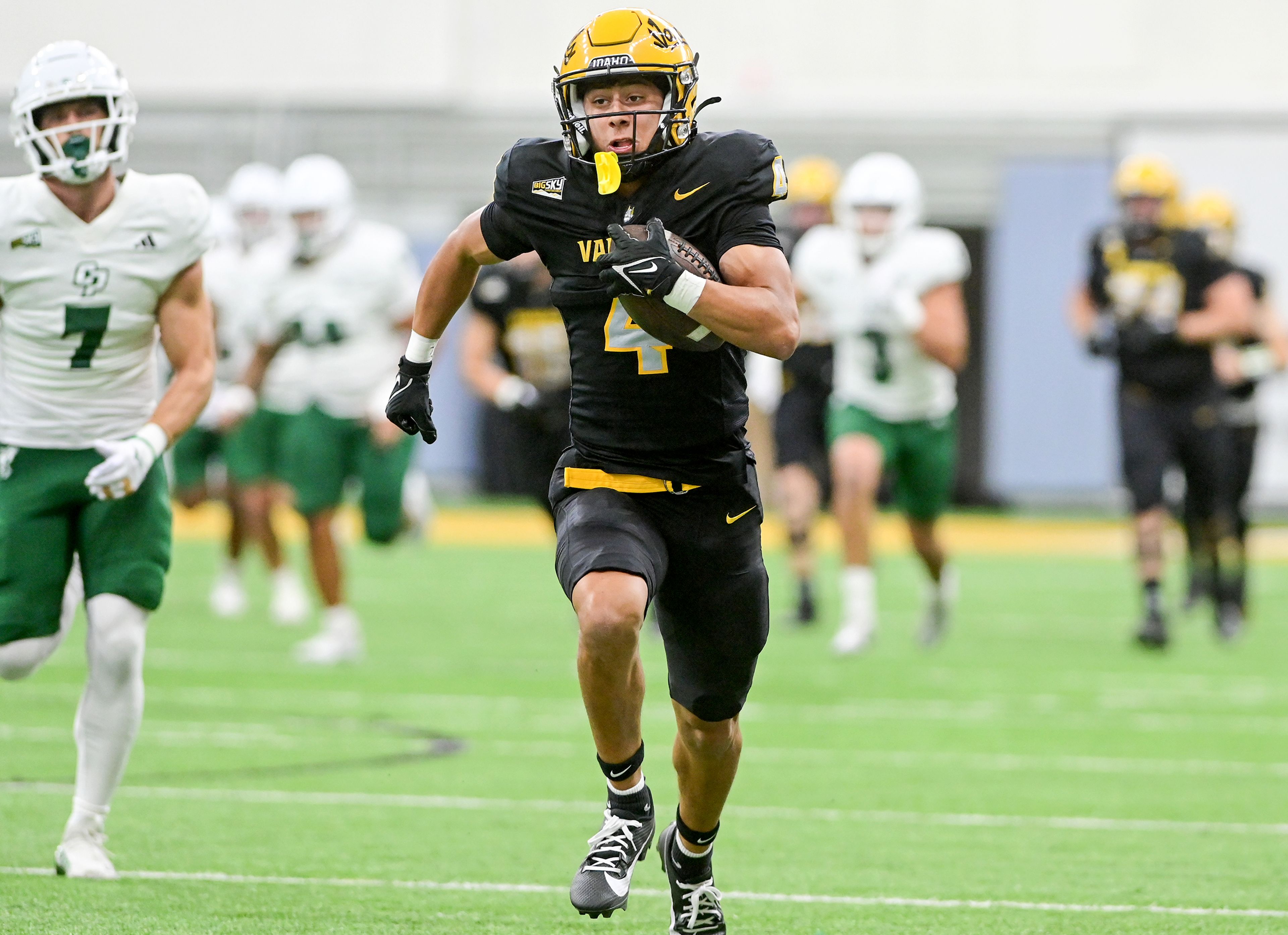 Idaho wide receiver Tony Harste carries the ball in a breakaway play against Cal Poly Saturday at the P1FCU Kibbie Dome in Moscow.,