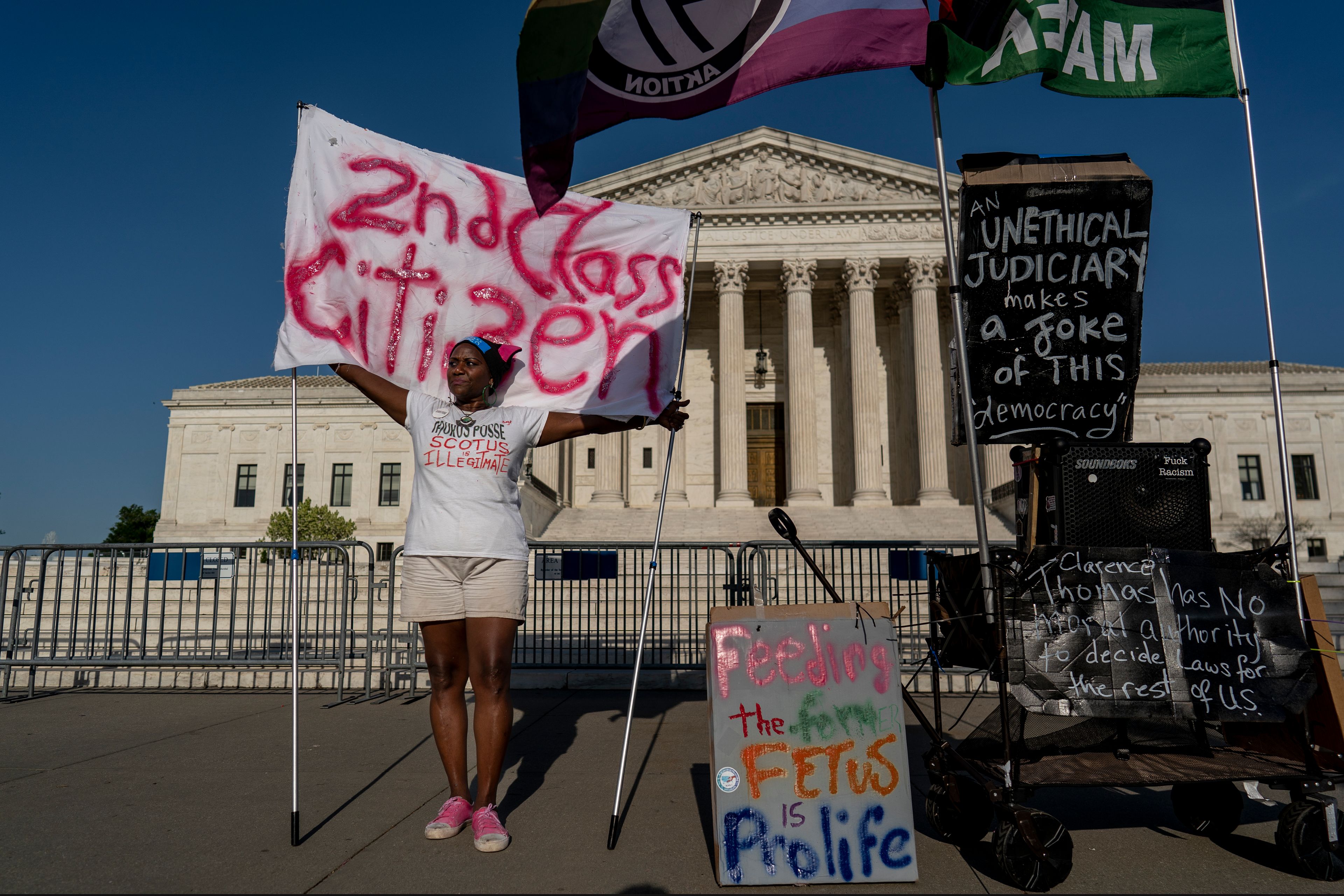 Activist Nadine Seiler of Waldorf, Md., demonstrates in front of the Supreme Court on Capitol Hill in Washington, Thursday, April 20, 2023, as she laments the absence of people to protest the conservative majority on the high court. Justices are leaving women's access to an abortion pill untouched until at least Friday, while they consider whether to allow restrictions on mifepristone to take effect. (AP Photo/J. Scott Applewhite)