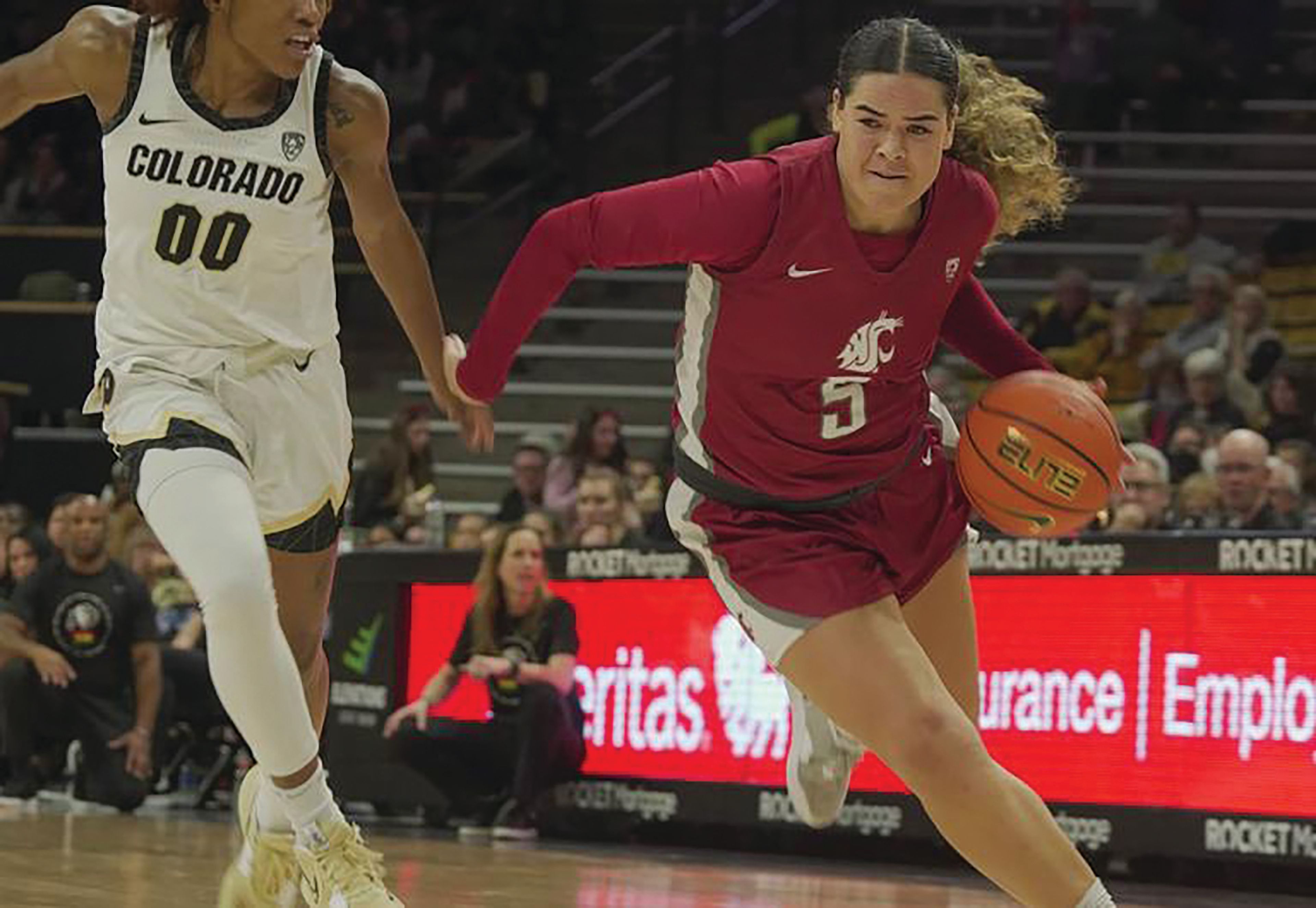 WSU Athletics Washington State junior guard Charlisse Leger-Walker drives past Colorado's Jaylyn Sherrod during the 2023 Pac-12 Conference game at the CU Events Center in Boulder, Colo.