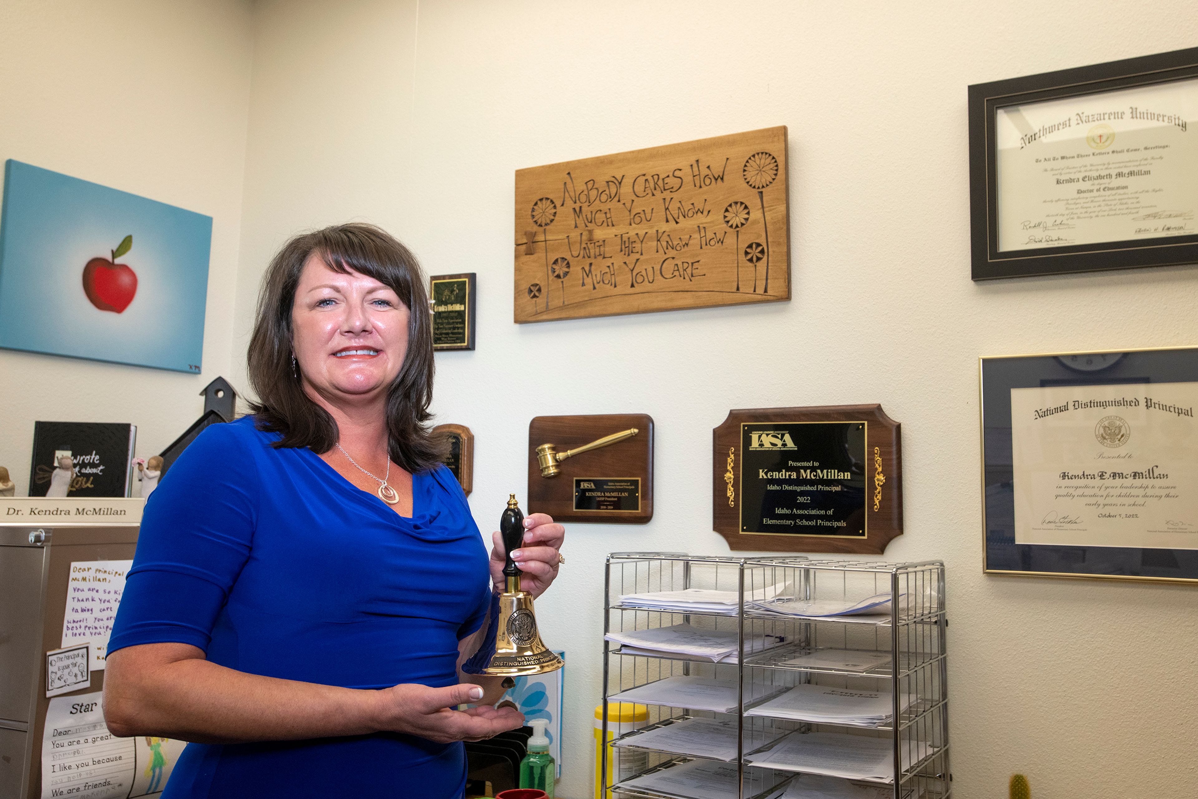 Principal Kendra McMillan poses in her office with a collection of awards from her recent trip to Washington D.C. as a recipient of the National Distinguished Principal award at Lena Whitmore Elementary School in Moscow.