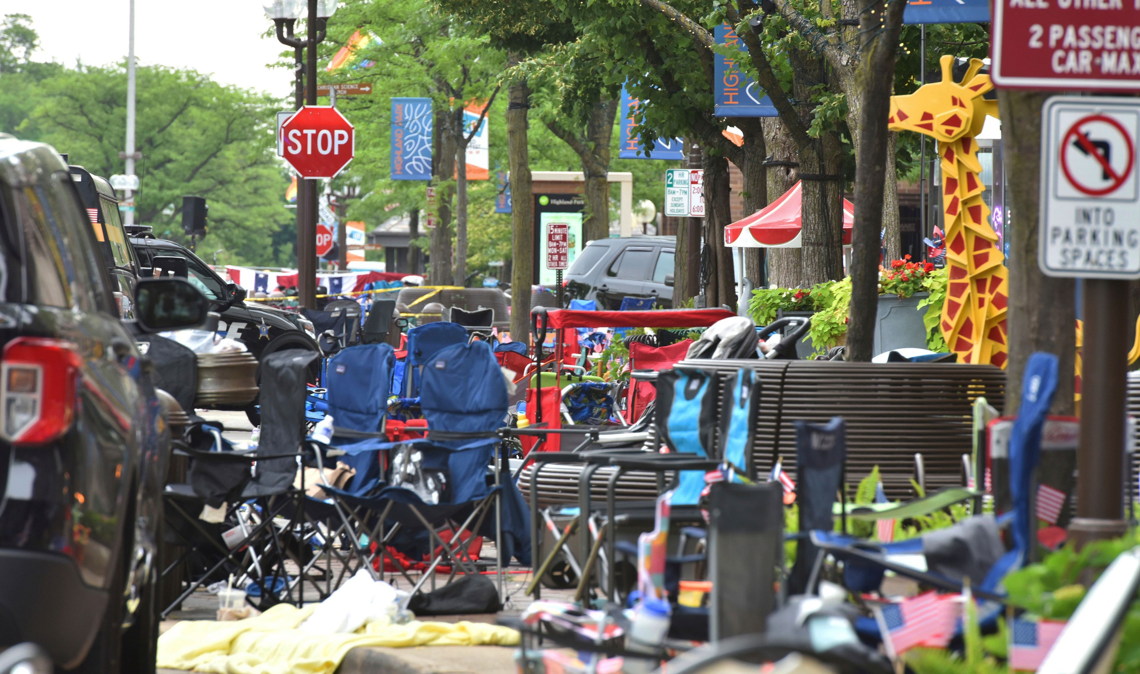 Abandoned chairs on the scene of a mass shooting at a Fourth of July parade on Central Avenue in Highland Park, Ill., on Monday, July 4, 2022. (John Starks/Daily Herald via AP)