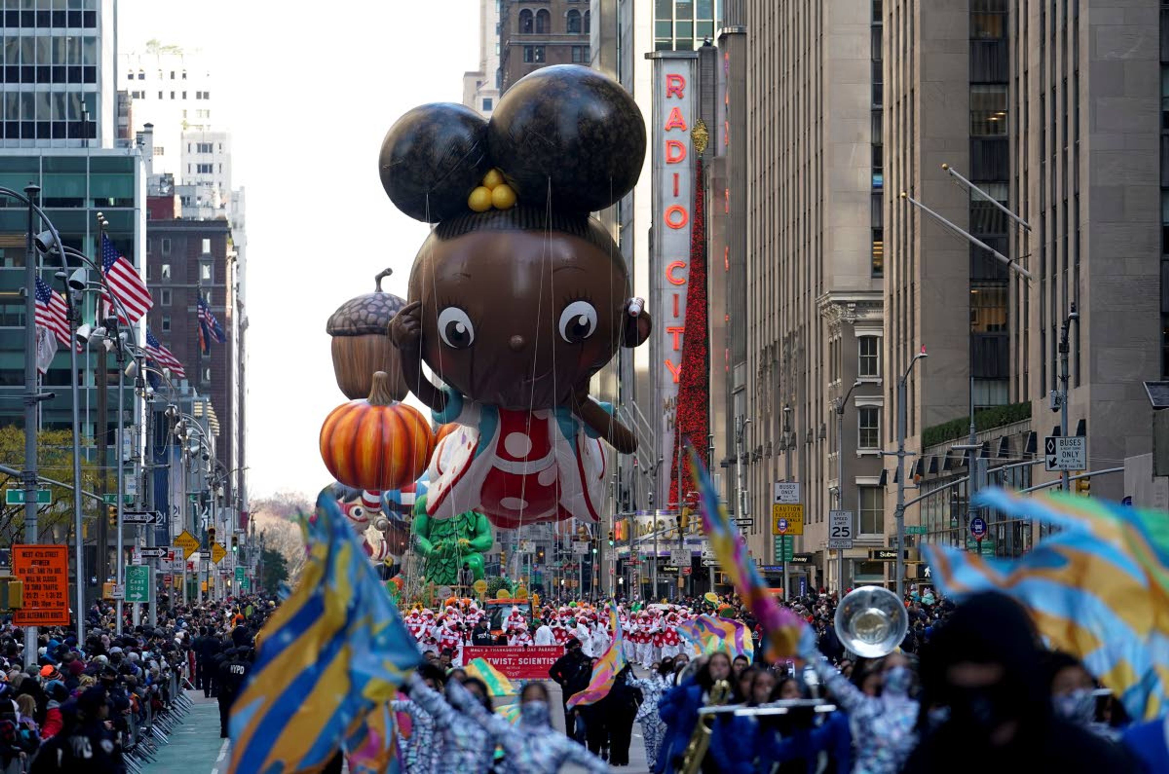 The Ada Twist balloon moves down Sixth Avenue during the Macy's Thanksgiving Day Parade in New York, Thursday, Nov. 25, 2021. The parade is returning in full, after being crimped by the coronavirus pandemic last year. (AP Photo/Jeenah Moon)