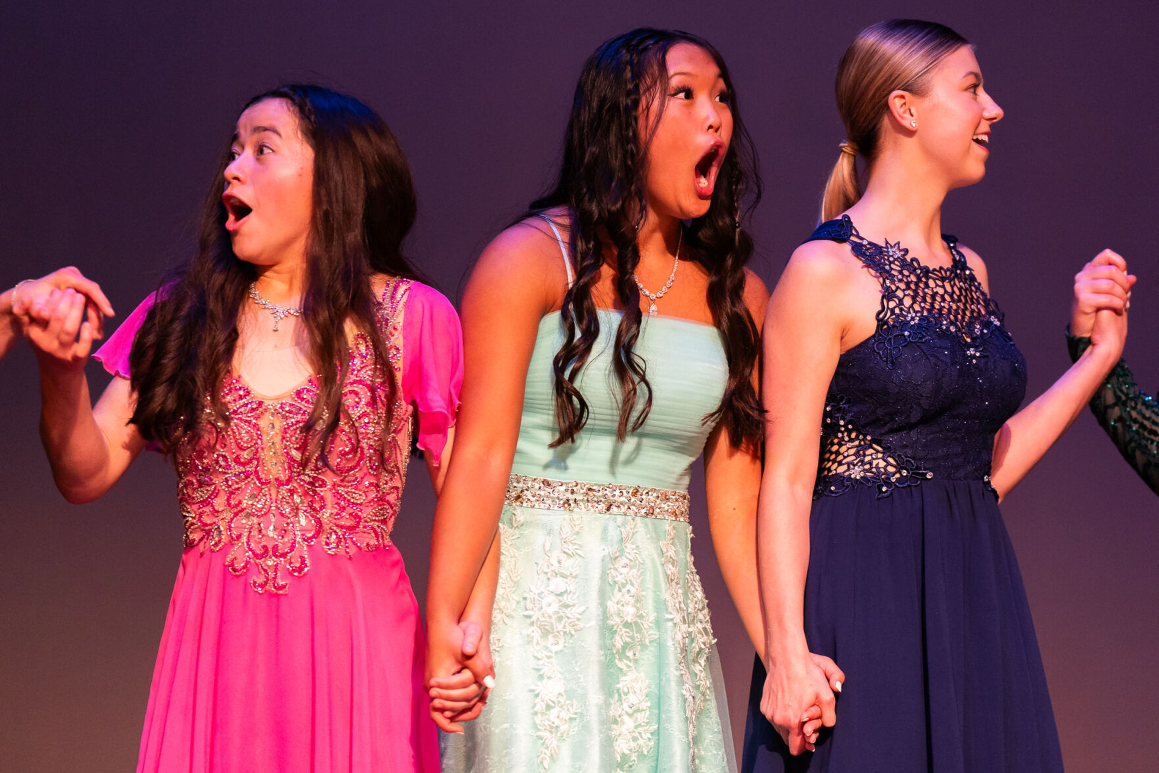 From left: Beth Okamoto, Gracie Wessels and Audrey Maryott react after Sydney Ohlemann is announced as the winner of the Washington Distinguished Young Woman competition on Saturday at Daggy Hall in Pullman. Ohlemann was unable to attend the event in-person, but was able to participate in each category through a Zoom call earlier in the day.