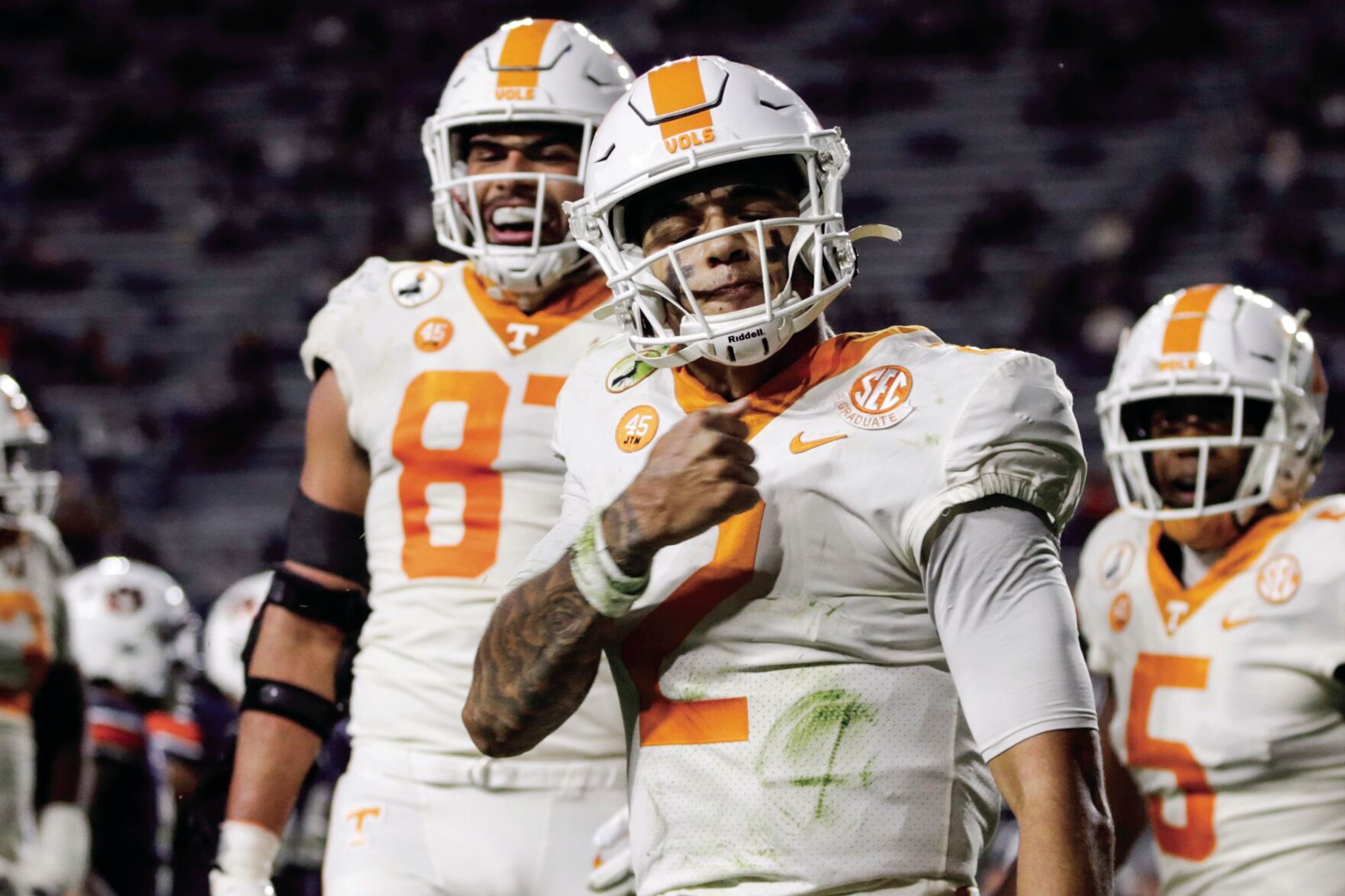 Jarrett Guarantano, center, celebrates after scoring a touchdown for Tennessee in a Nov. 21 game at Auburn. Guarantano is battling to become Washington State’s starting quarterback in the fall.