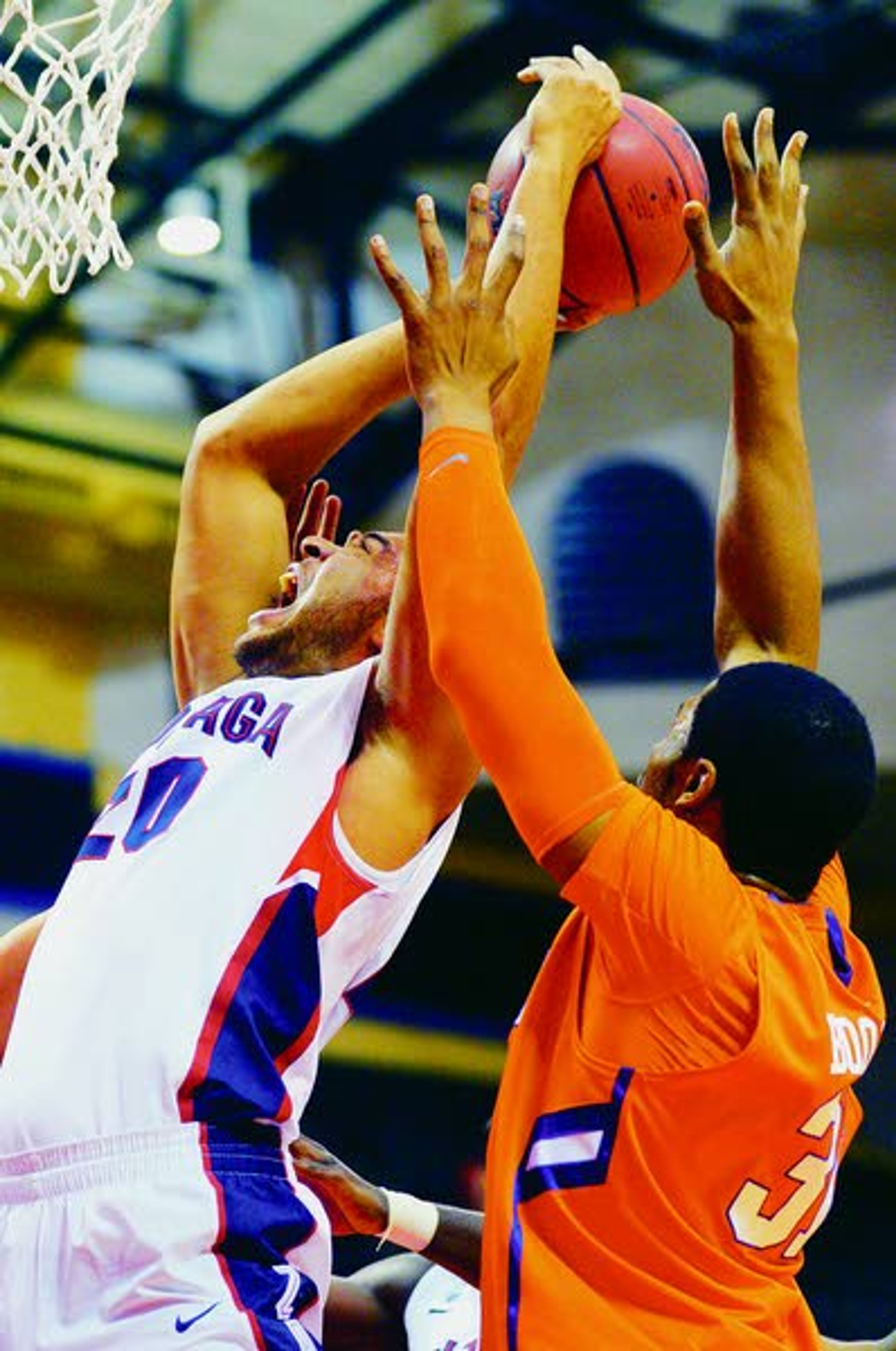 Gonzaga forward Elias Harris, left, is fouled by Clemson forward Devin Booker while going up for a shot during the first half of Thursday’s game at the Old Spice Classic in Kissimmee, Fla.