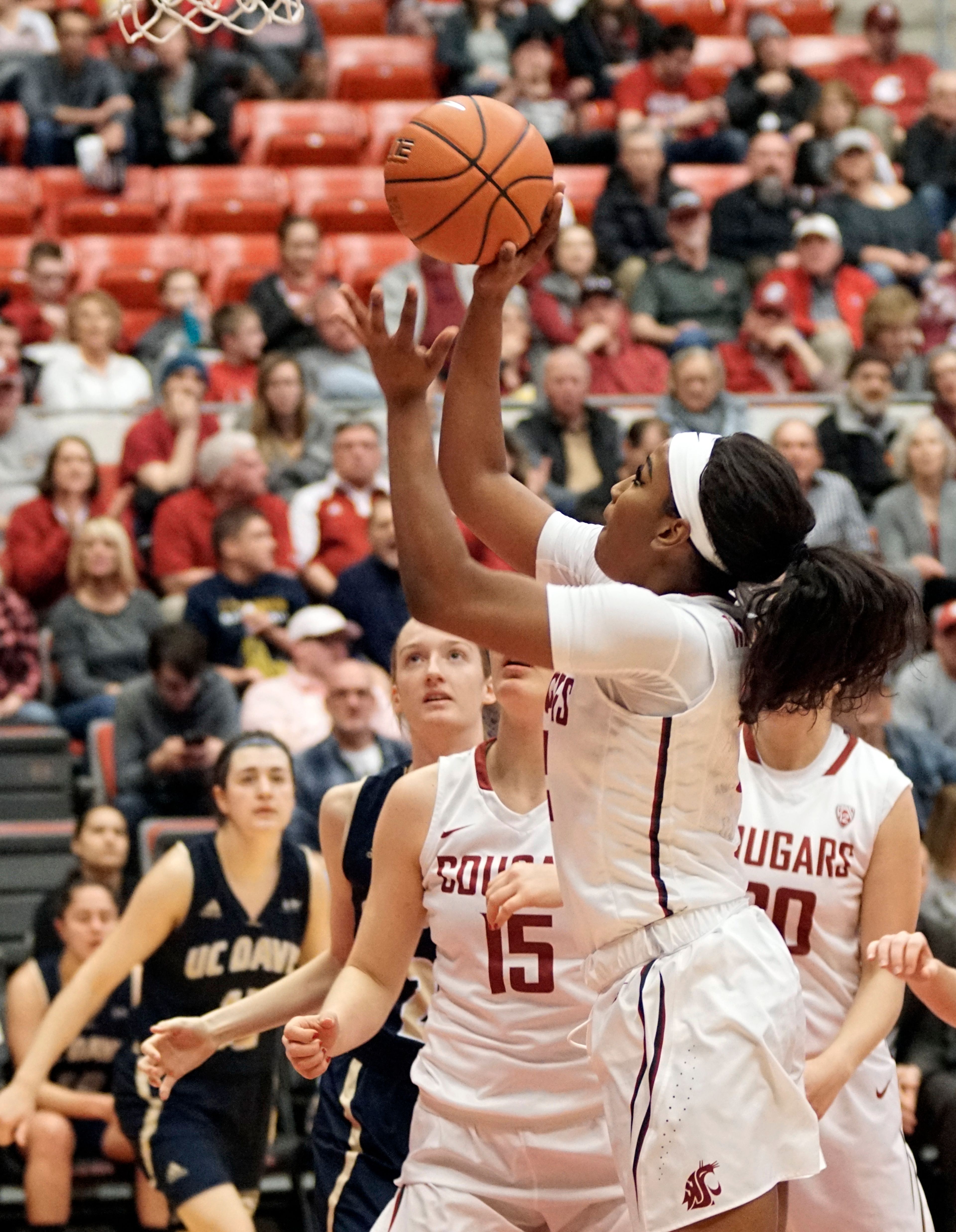 Washington State's Kayla Washington puts up a shot against UC Davis during a third round game of the WNIT at Beasely Coliseum Thursday night.