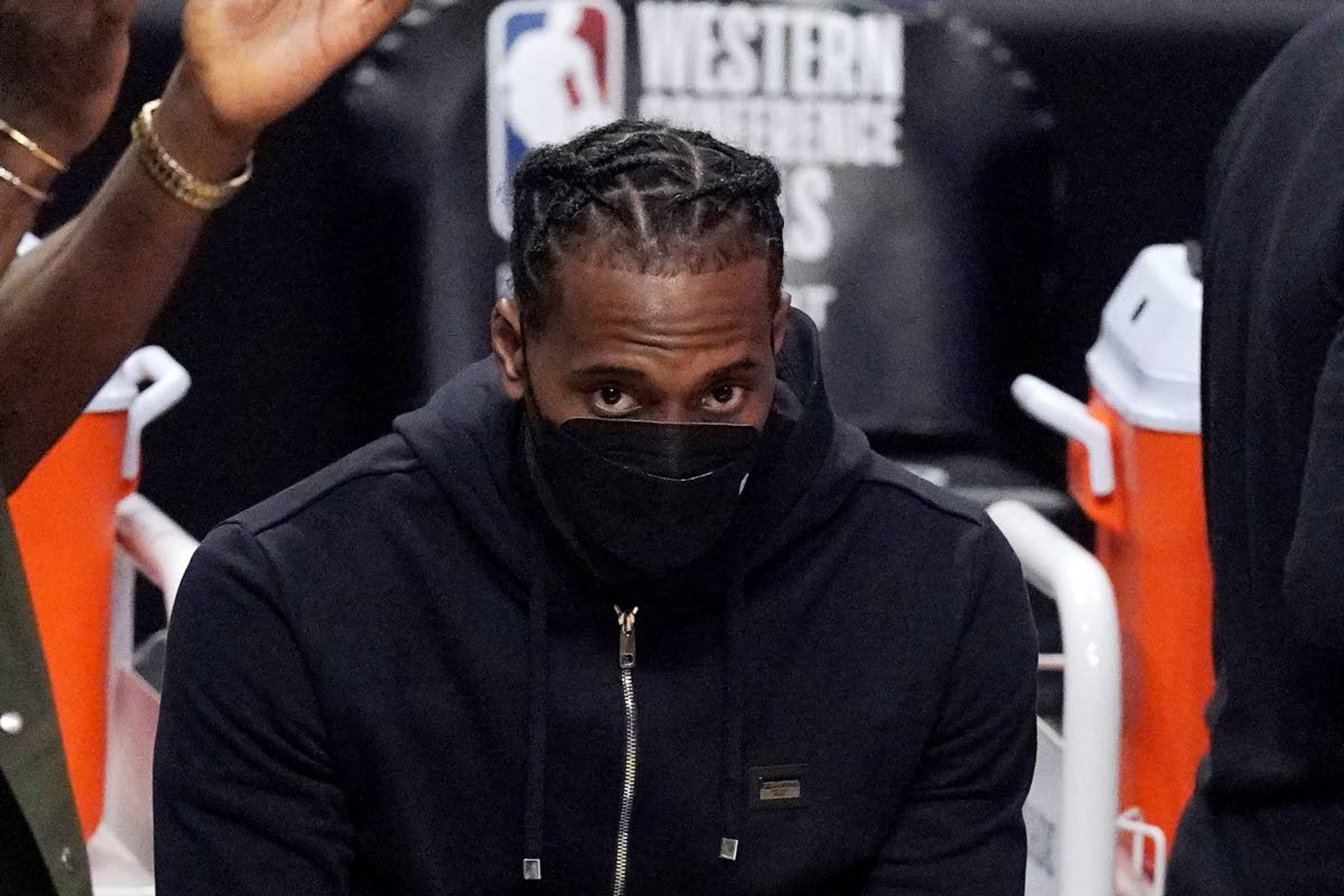 Los Angeles Clippers forward Kawhi Leonard sits on the bench during the first half in Game 6 of the NBA basketball Western Conference Finals against the Phoenix Suns Wednesday, June 30, 2021, in Los Angeles. (AP Photo/Mark J. Terrill)