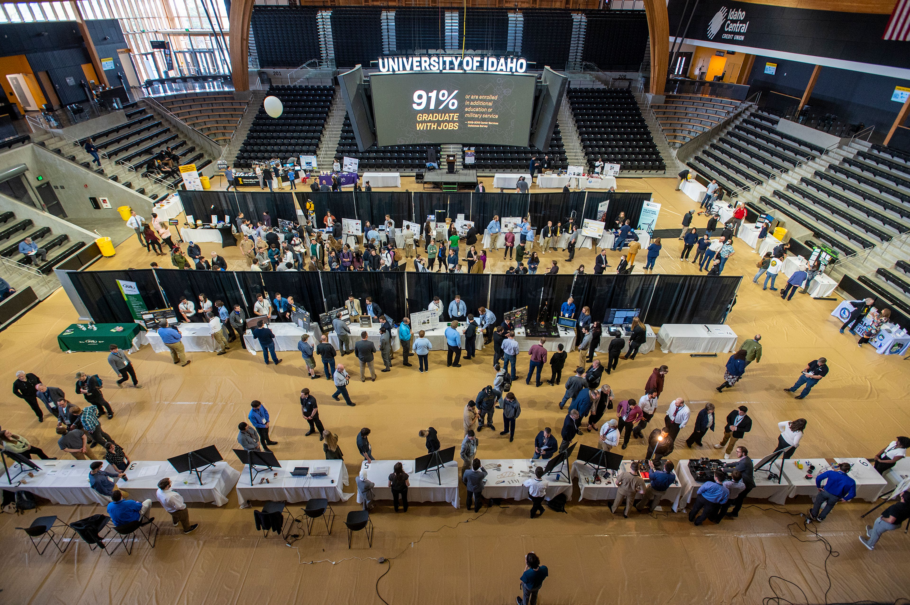 Judges, students and visitors fill the floor of Idaho Central Credit Union Arena during the University of Idaho College of Engineering’s annual Engineering Design Expo on Friday morning in Moscow.