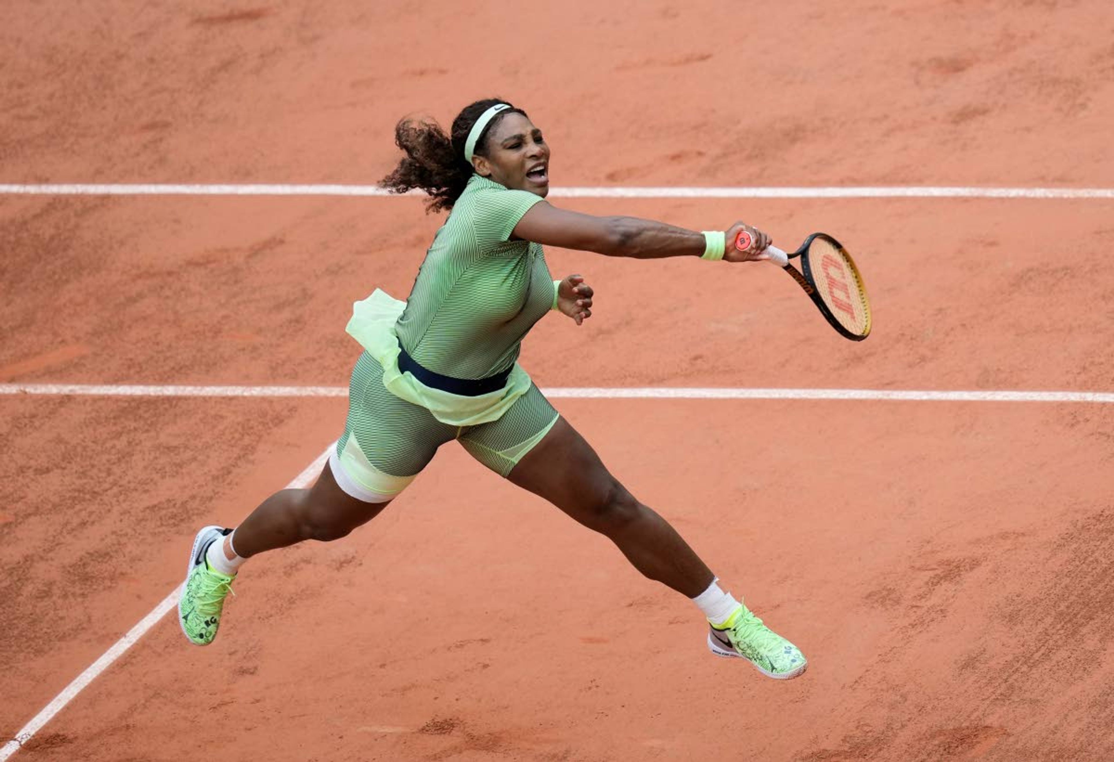 Associated PressSerena Williams serves to Romania’s Mihaela Buzarnescu during their second round match on Day 4 of the French Open tennis tournament Wednesday at Roland Garros in Paris.