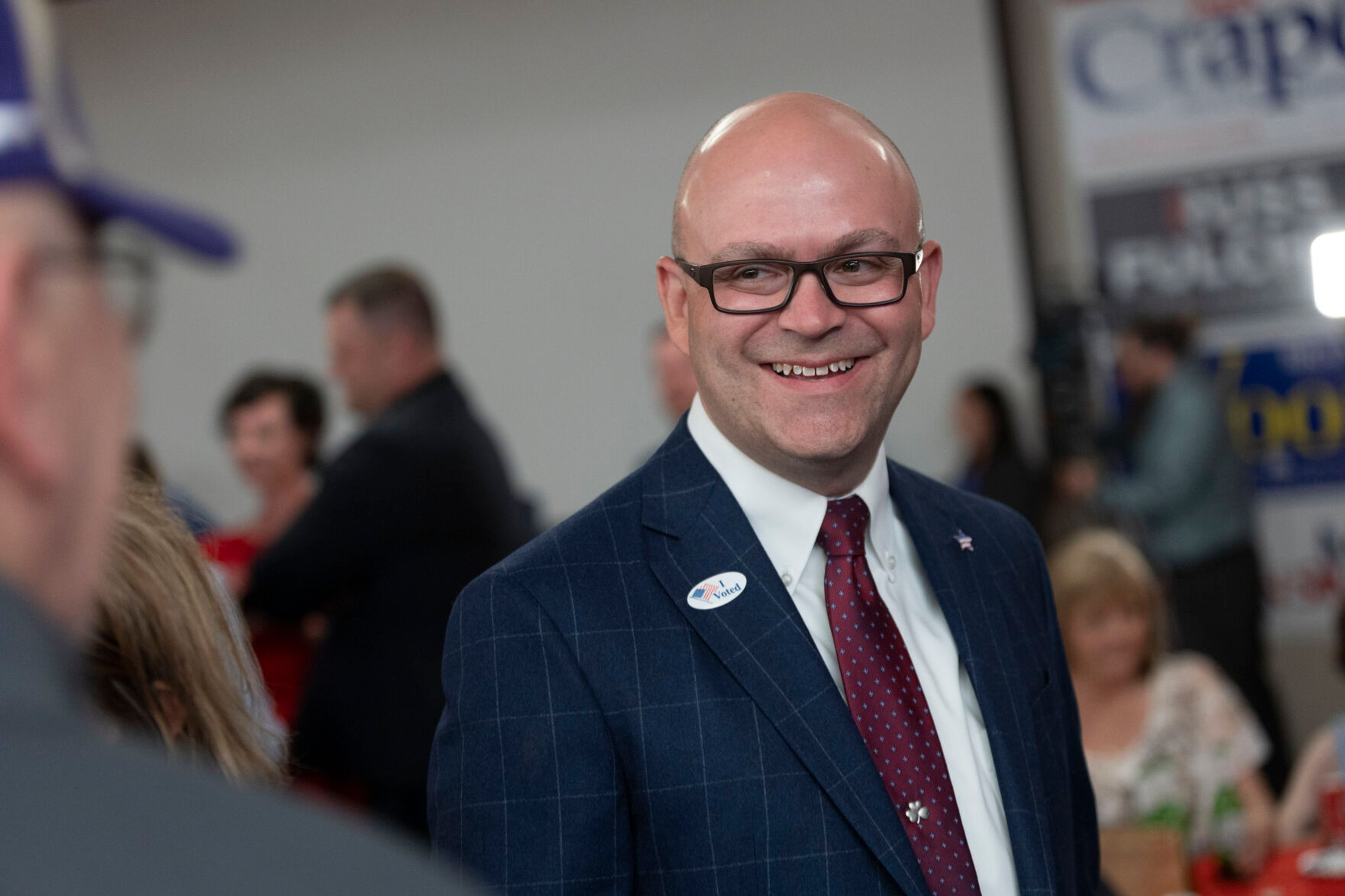 FILE - Idaho Secretary of State candidate Phil McGrane laughs as he talks with an attendee during the Republican Party primary celebration in Boise, Idaho, on May 17, 2022. McGrane, who is the Ada County clerk and the likely next secretary of state, says investigating complaints related to elections is important to maintain voter confidence that America's system for choosing its leaders works. (AP Photo/Kyle Green, File)