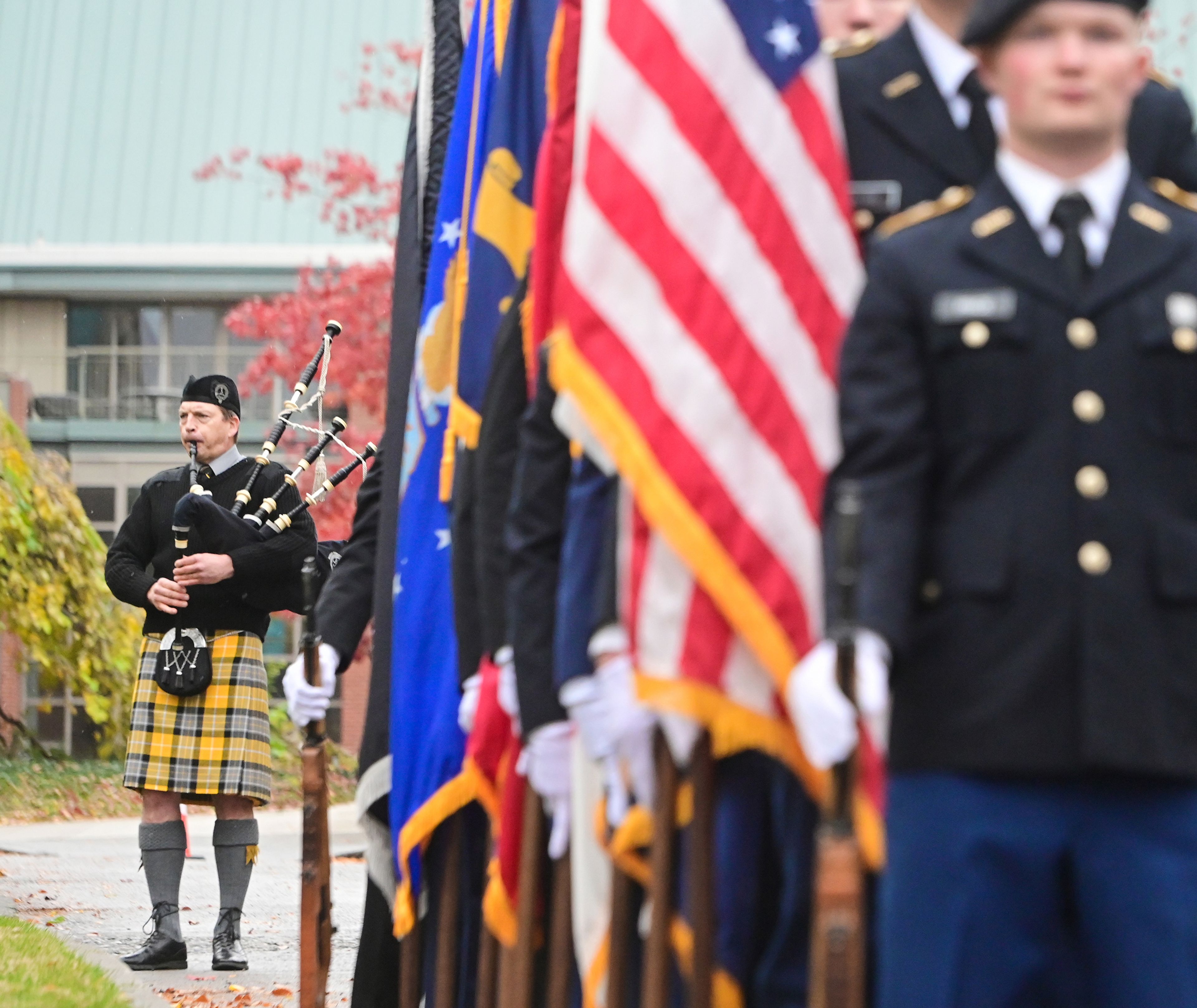 Ben Hunter, left, dean of University of Idaho Libraries, plays the bagpipes at the UI Veterans Day wreath-laying ceremony Monday in Moscow.