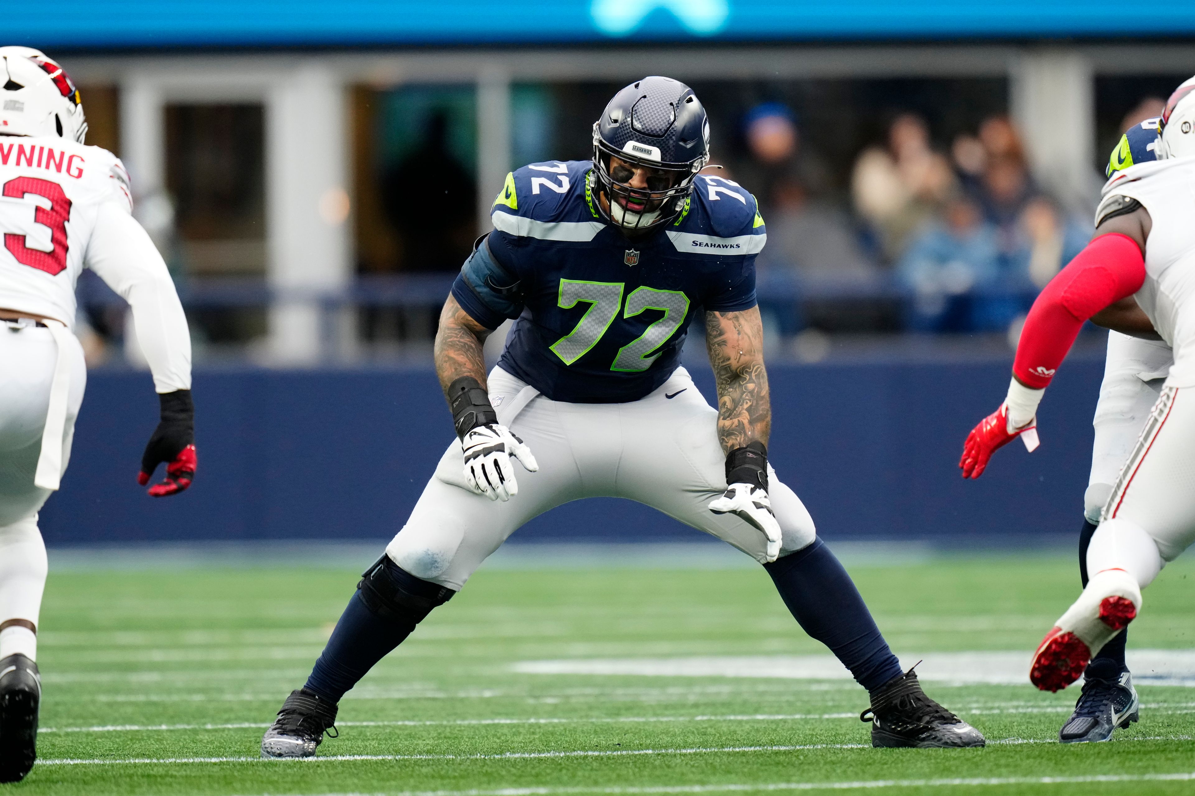 Seattle Seahawks offensive tackle Abraham Lucas (72) gets set during an NFL football game against the Arizona Cardinals, Sunday, Nov. 24, 2024 in Seattle. The Seahawks defeated the Cardinals 16-6. (AP Photo/Ben VanHouten)