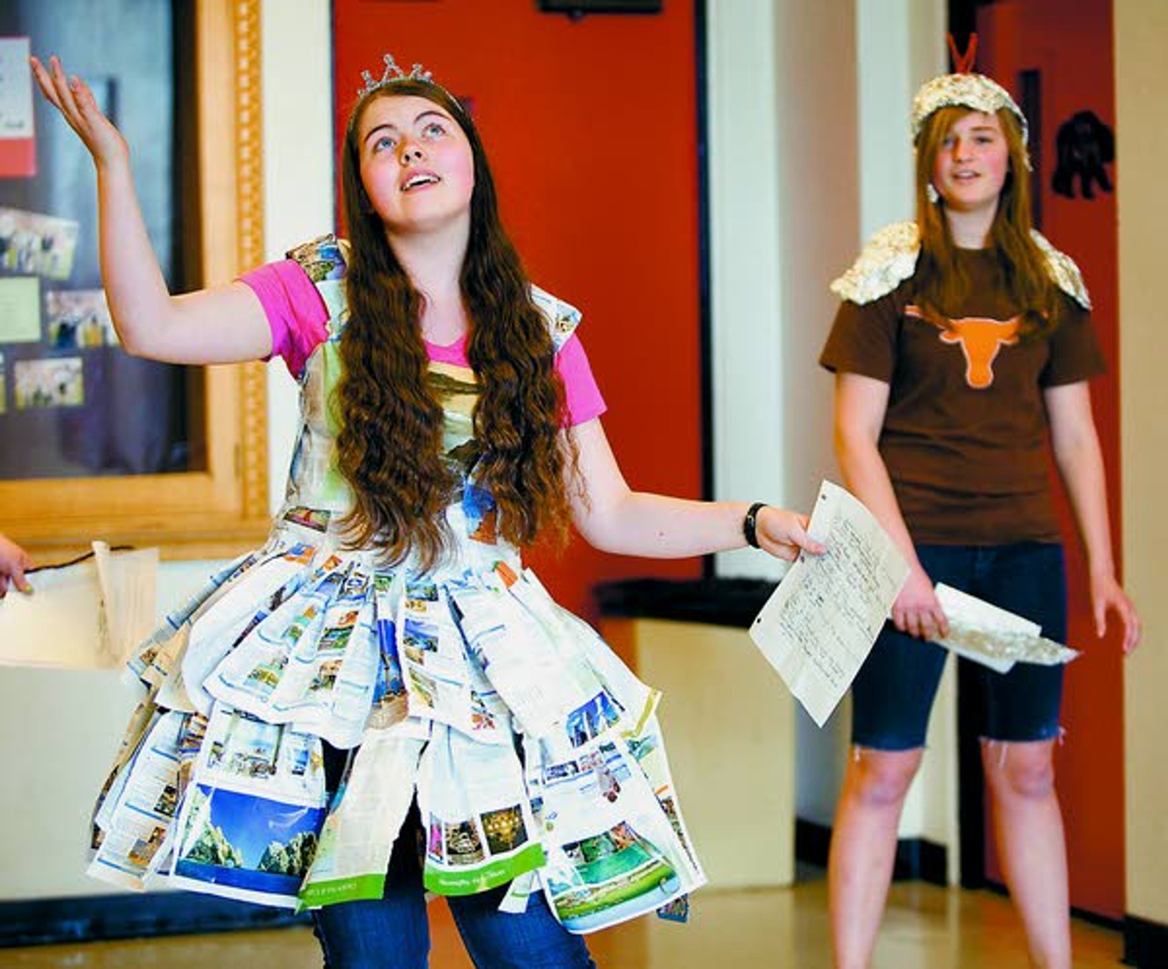 Andrea St. Pierre, left, and Alena Perriguey-Krings rehearse a skit about land transportation with their team at the Future Problem Solving State Bowl at Moscow High School on Saturday.