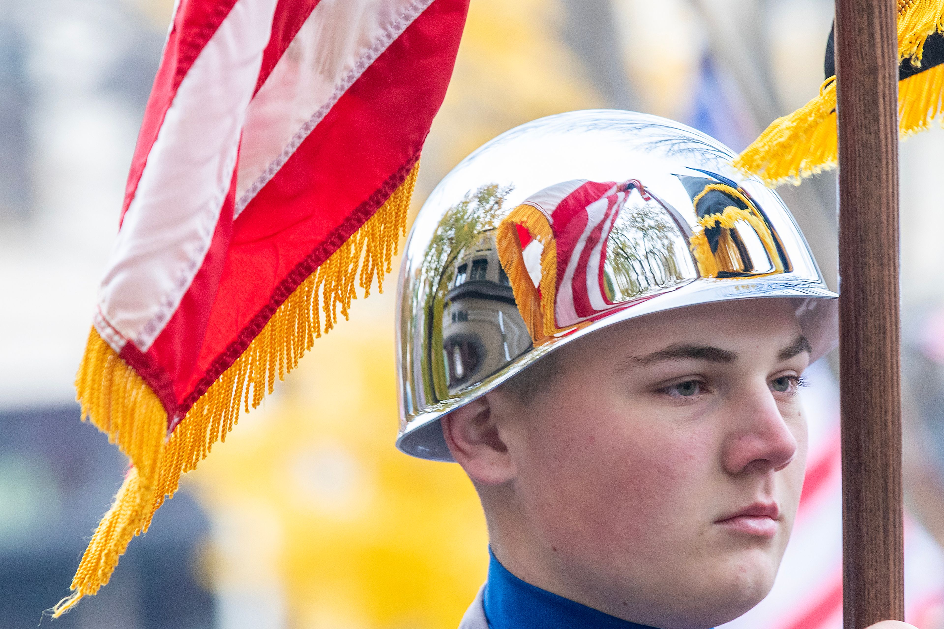 A member of the Idaho Youth Challenge Academy carries an American flag Saturday at the Veteran’s Day Parade on Main Street in Lewiston.