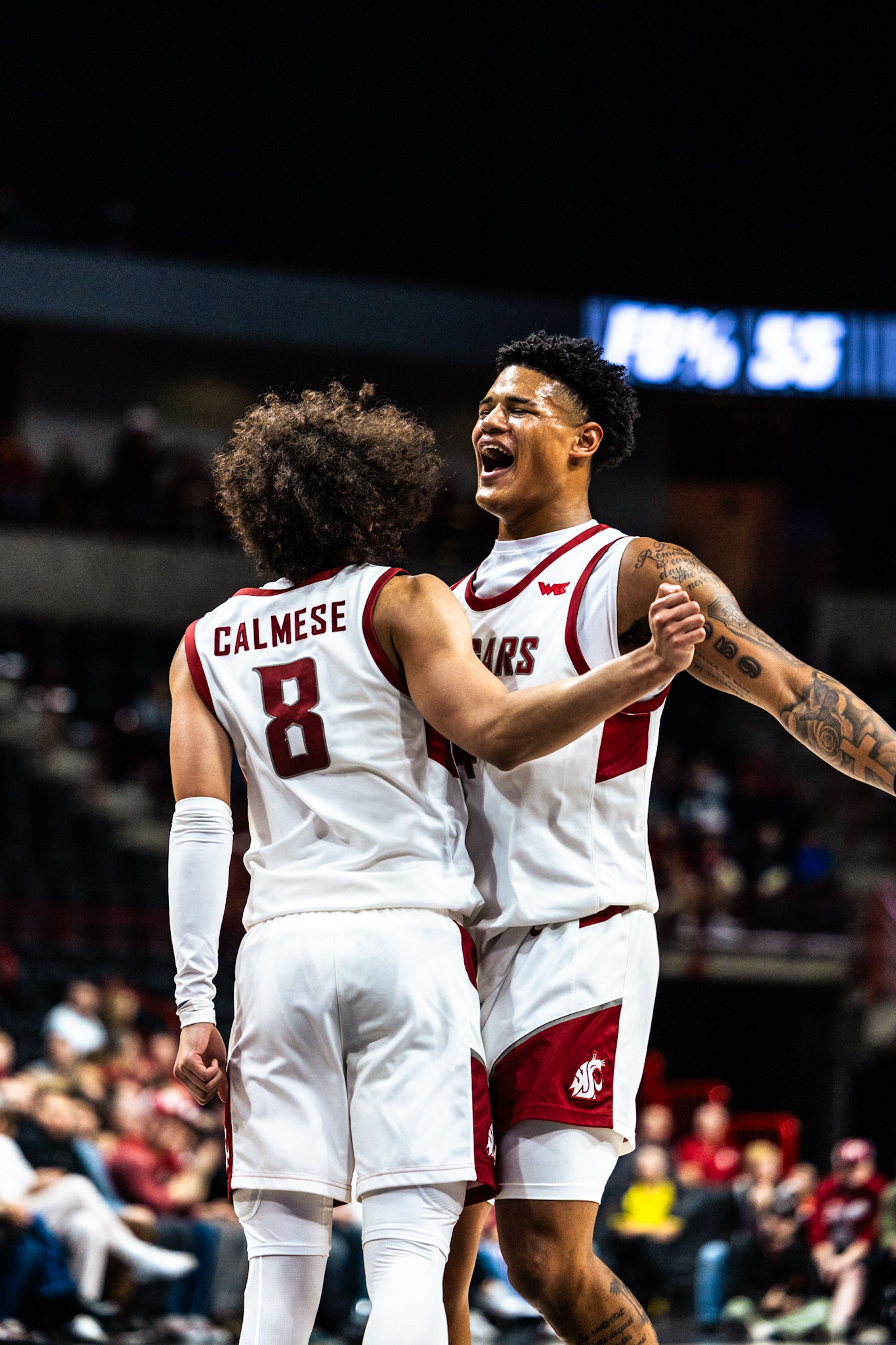 Washington State's Nate Calmese and a teammate celebrate during a game against Eastern Washington on Thursday in Spokane.