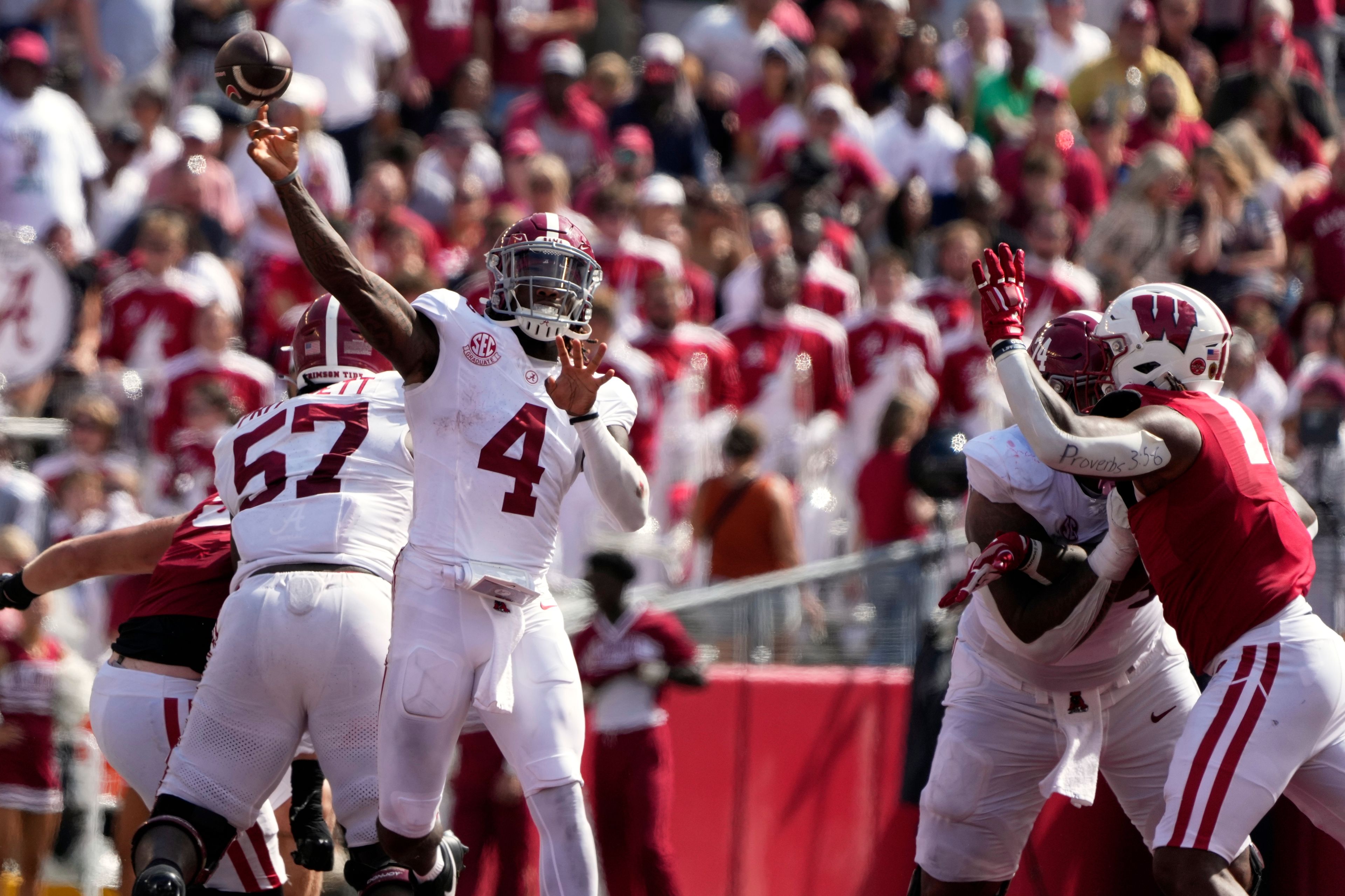 Alabama's Jalen Milroe (4) thorws a pass during the second half of an NCAA college football game against Wisconsin Saturday, Sept. 14, 2024, in Madison, Wis. (AP Photo/Morry Gash)