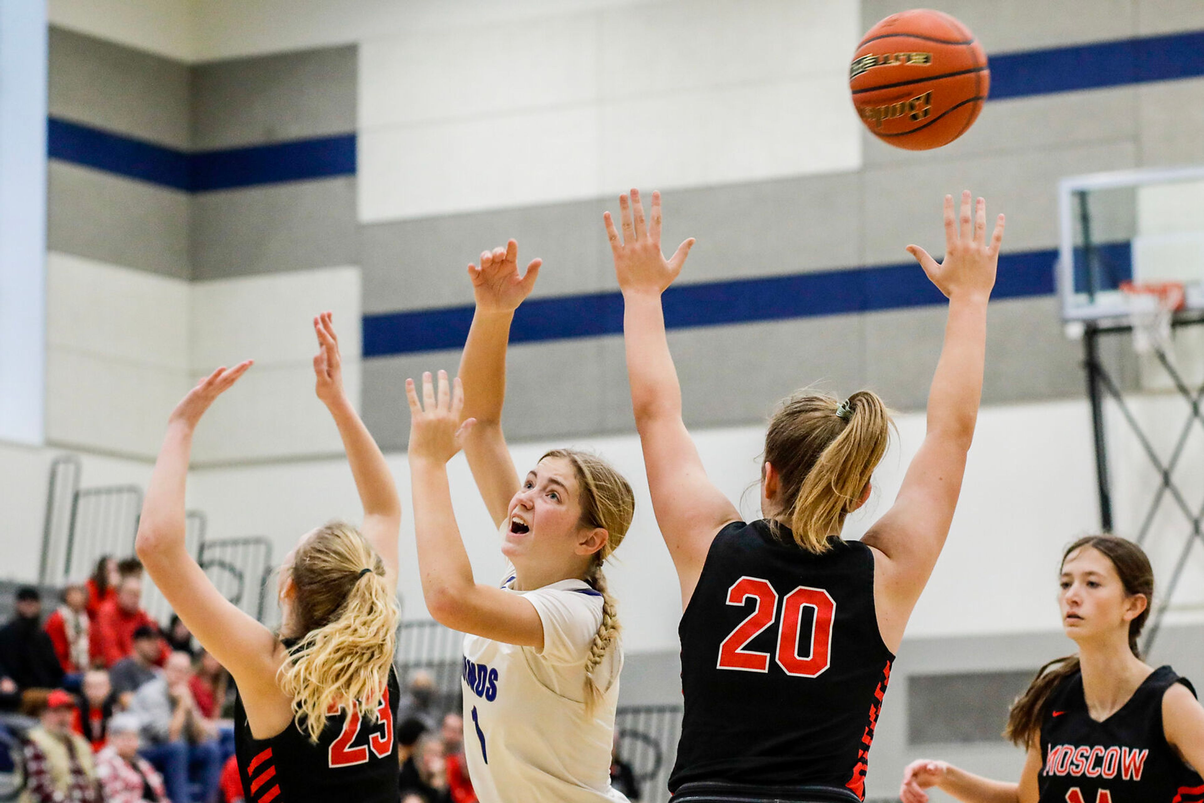 Pullman guard Megan Limburg, center, loses the ball as Moscow forward Jessa Skinner, left, and forward Lola Johns defend during Saturday's nonleague girls basketball game.