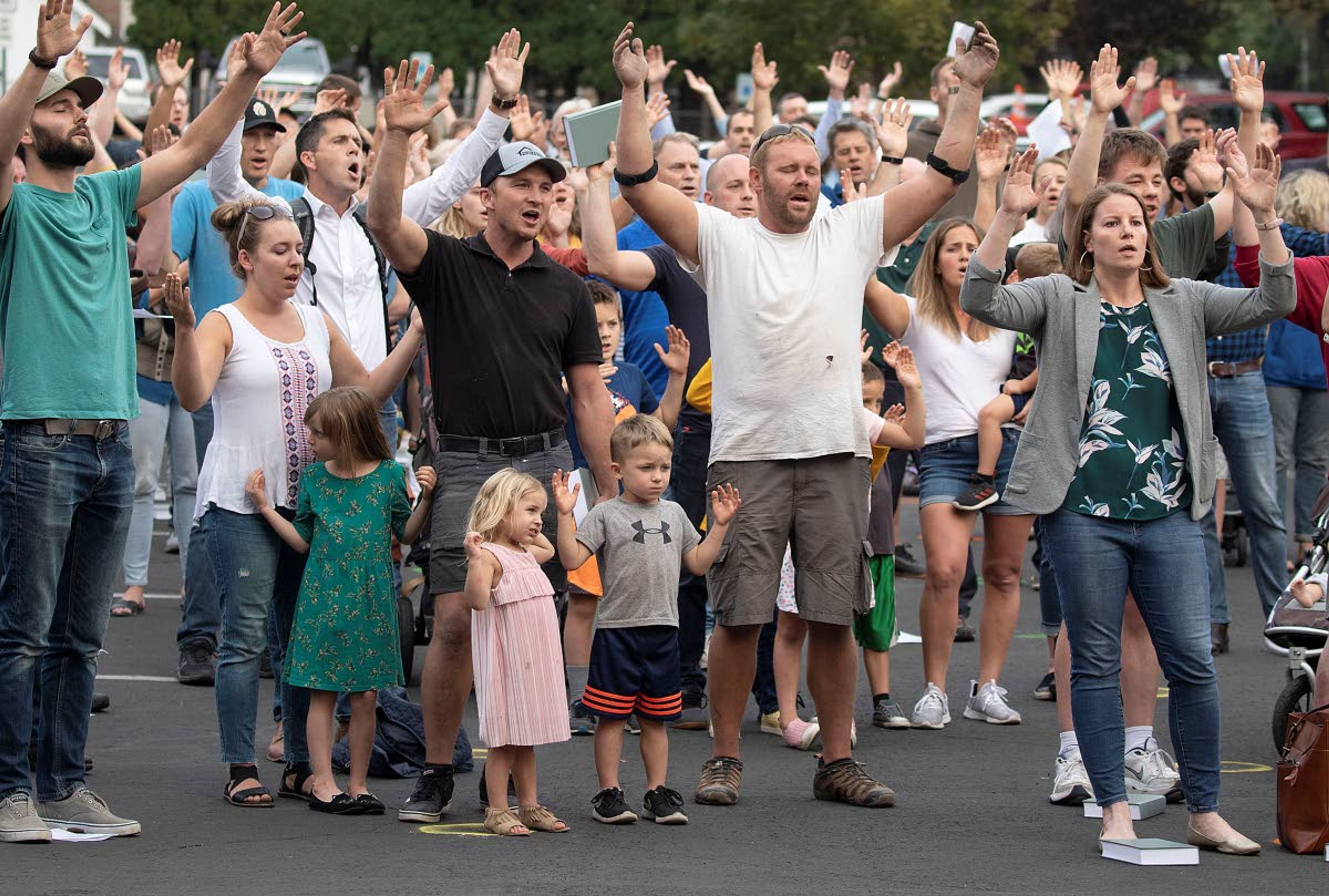 Christ Church members and guests sing “The Doxology” during a “flash psalm sing” organized by the church in September outside Moscow City Hall.