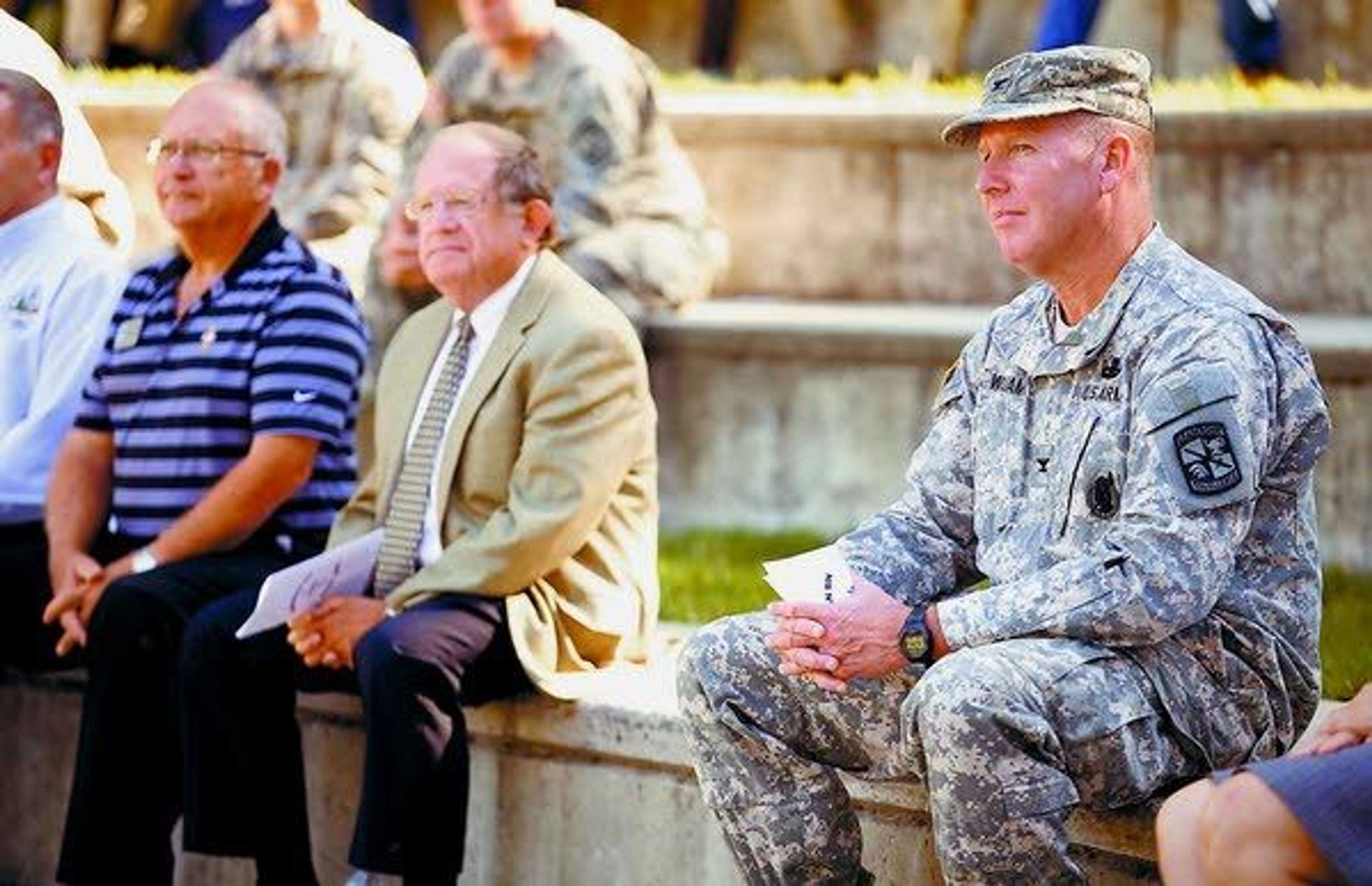 Col. Samuel Williams, right, watches as Army ROTC cadets who completed training this summer get awards at the the University of Idaho in Moscow Wednesday. Williams is is responsible for Army ROTC programs in Idaho and throughout the Pacific region. Also attending were UI Dean of Students Bruce Pitman, center, and Moscow City Councilor Wayne Krauss.