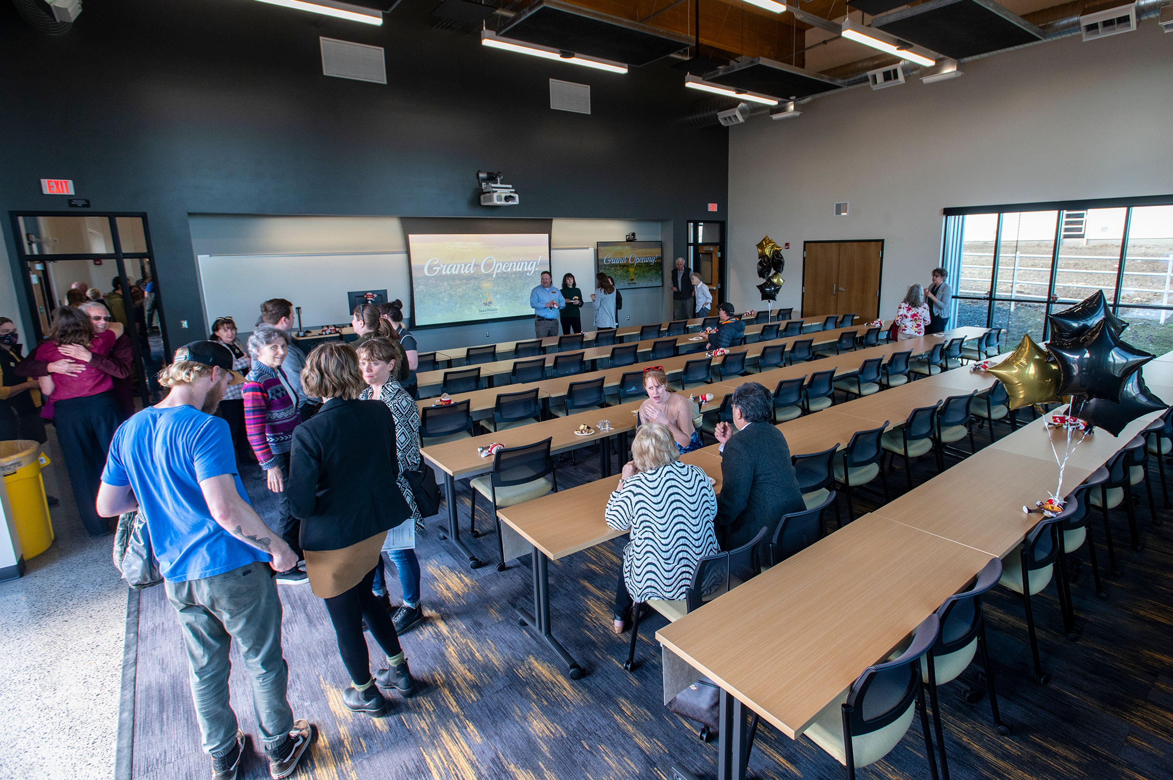 Guests mingle inside of the University of Idaho’s new Seed Potato Germplasm Laboratory during its grand opening Tuesday afternoon in Moscow.