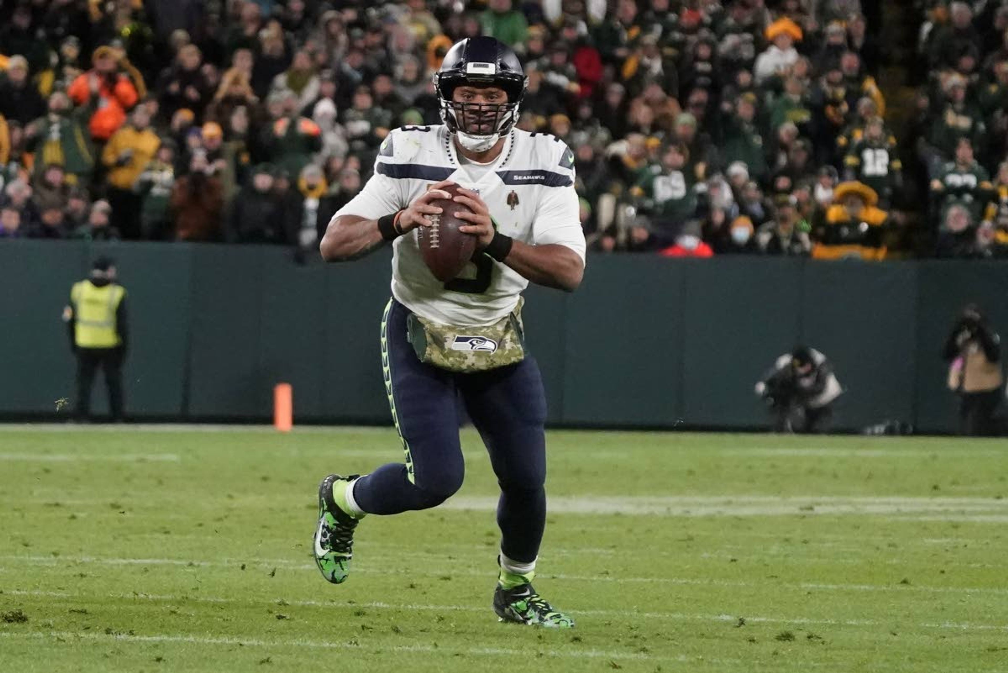 Seahawks quarterback Russell Wilson scrambles during the second half of a game against the Packers on Sunday in Green Bay, Wis.