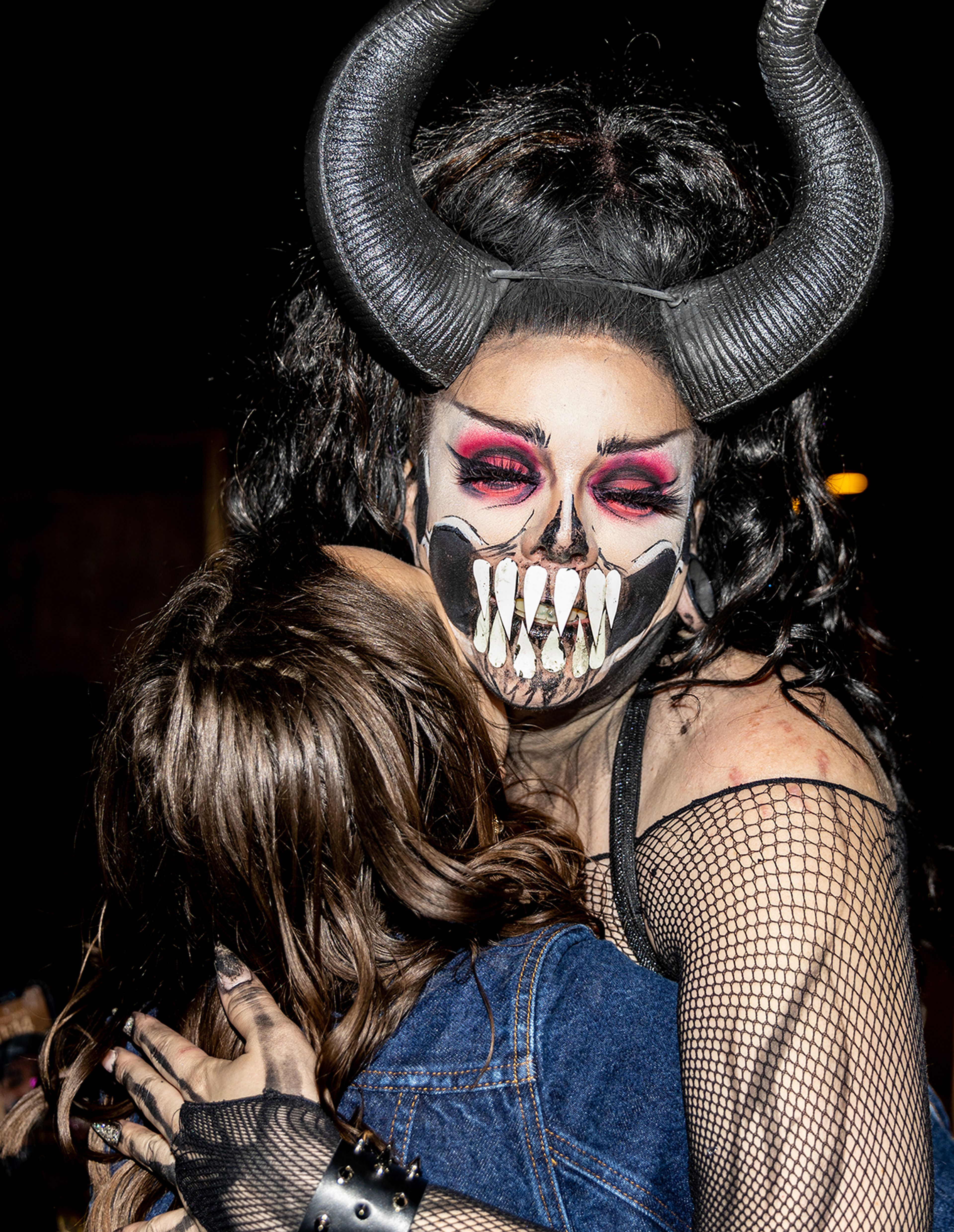 Wabaunsee hugs an excited fan March 15 after closing out the final night of the Lipstick Divas drag show at the Boomtown Saloon.