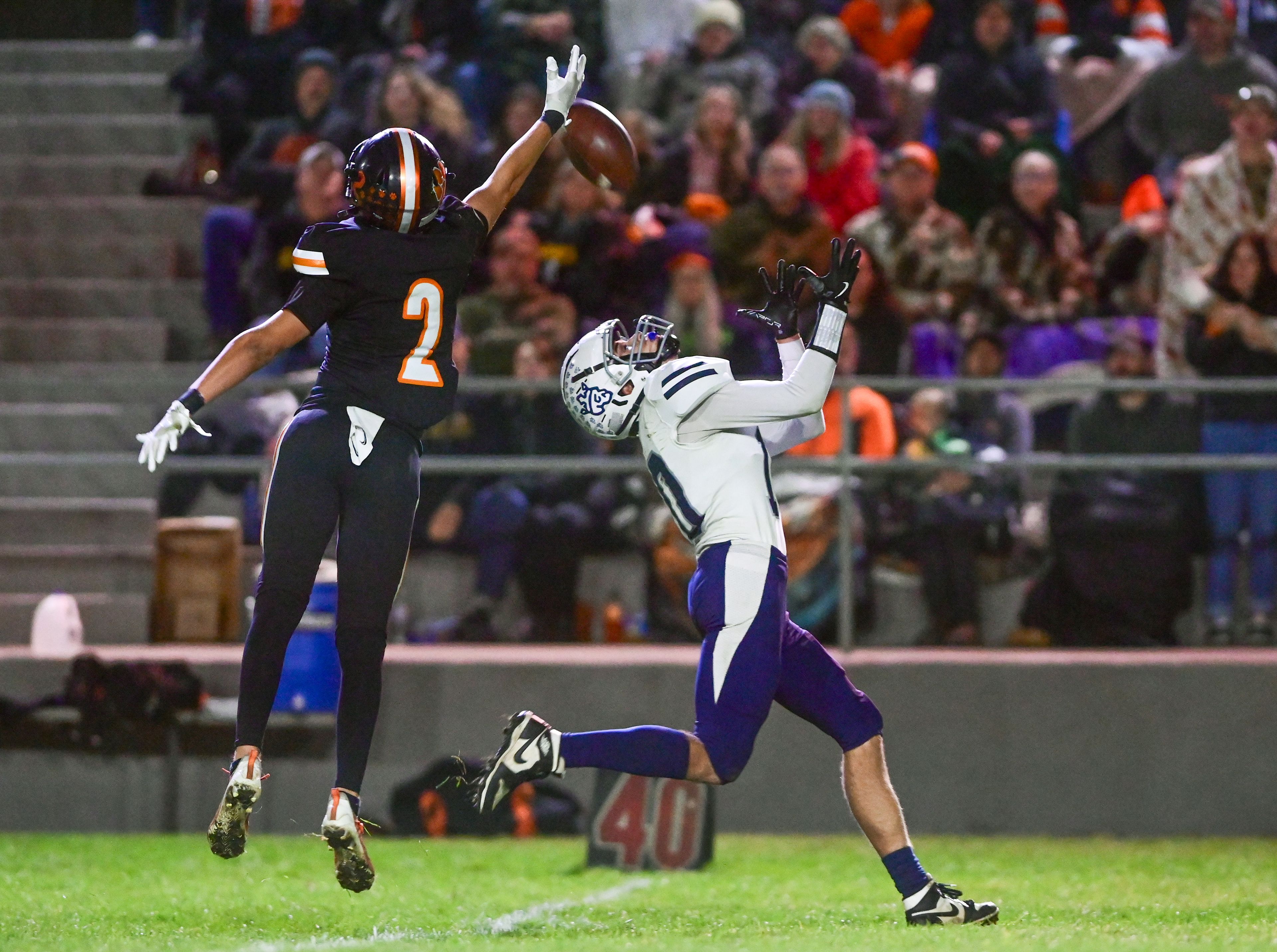 Kendricks Ralli Roetcisoender blocks a pass intended for Logos Dominic Porras Friday in Kendrick.,