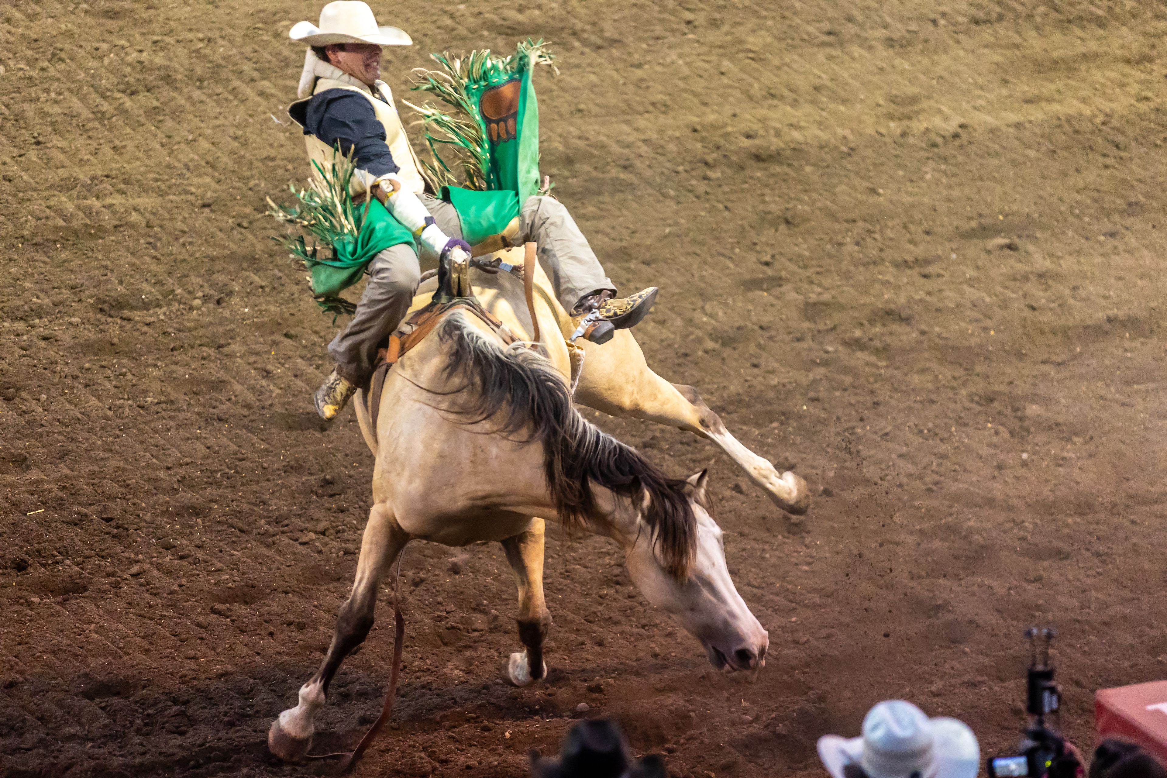 Mason Payne is tossed back and forth on a ride of Mustard in the bareback competition on day 3 of the Lewiston Roundup.