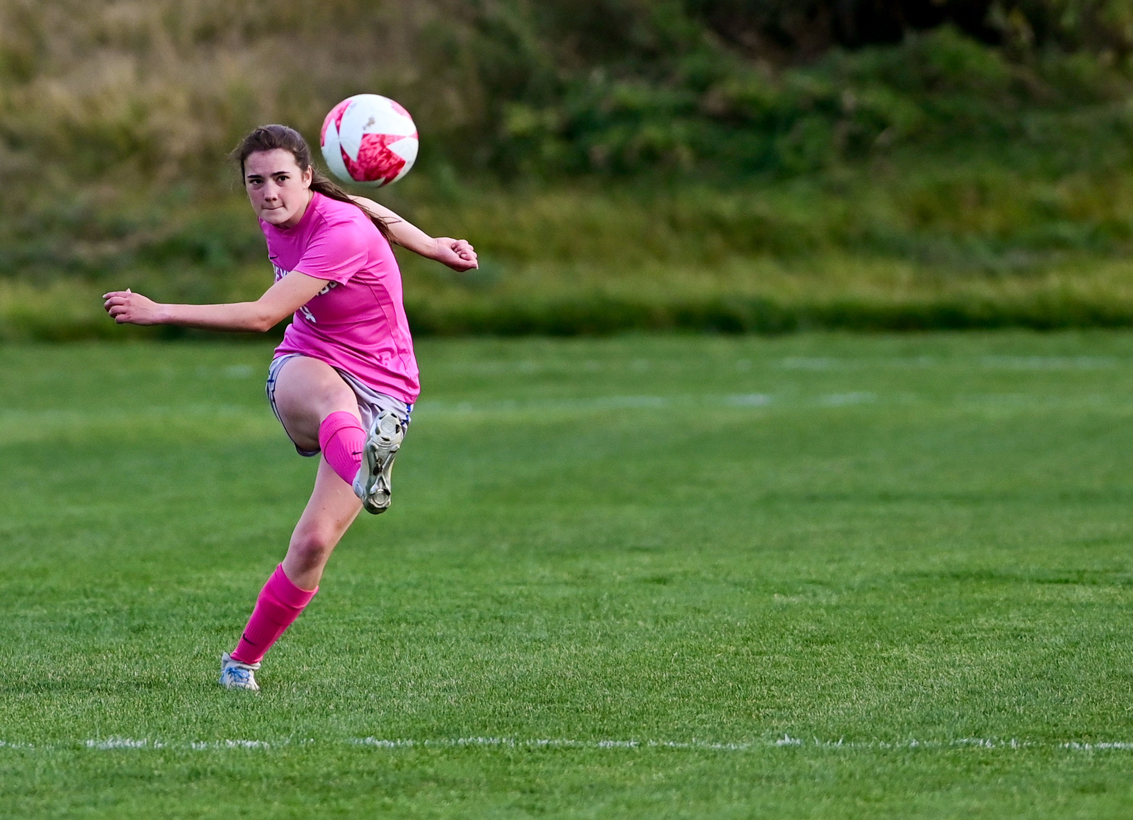 Pullman senior Amelia Cobos takes a free kick during a game against Deer Park Thursday in Pullman.,