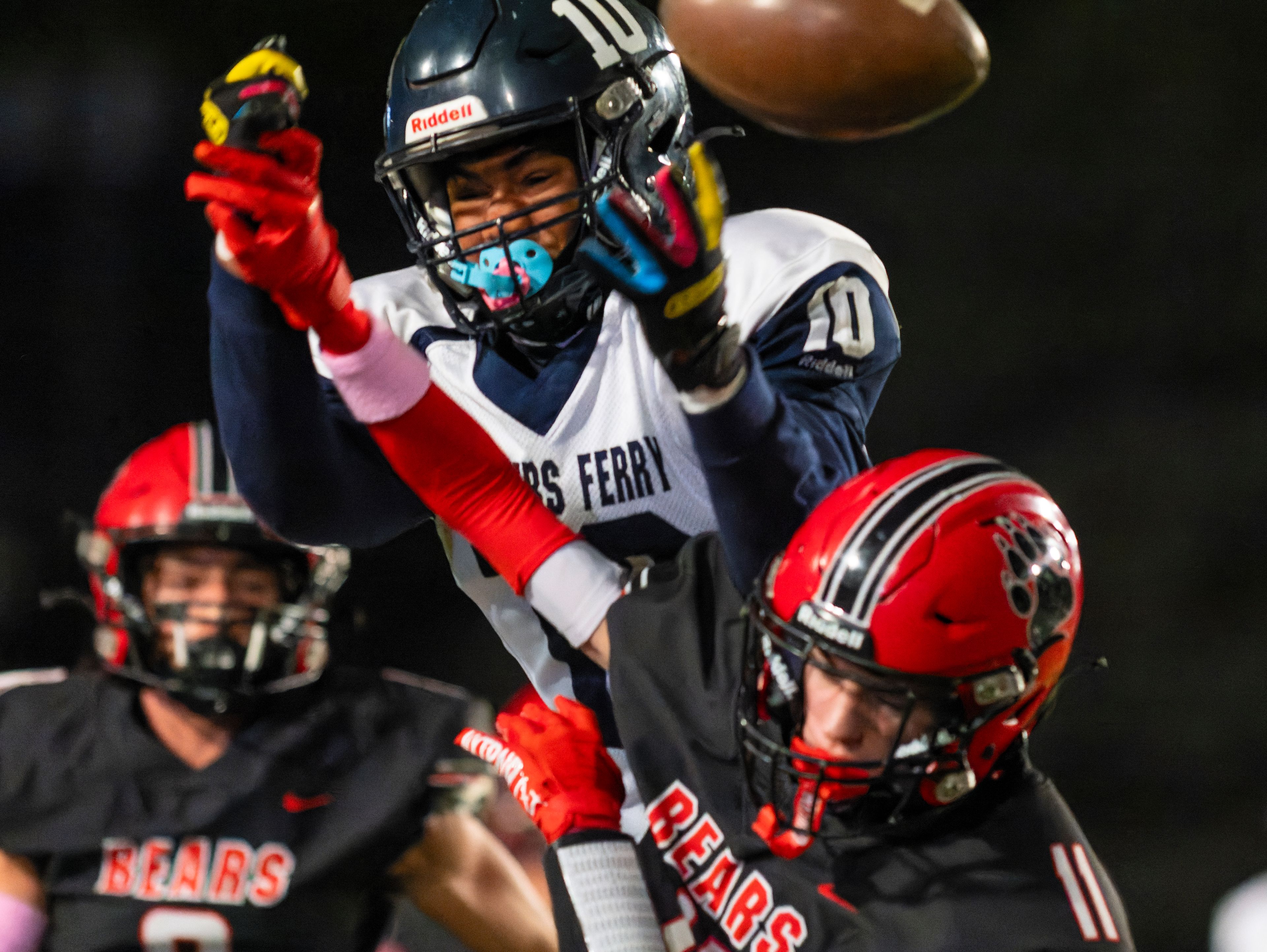 Moscow defensive back Graysen Hennrich (11) breaks up a pass intended for Bonners Ferry wide receiver Salaymanu Abubakari (10) during a game against the Bonners Ferry Badgers on Friday night at Bear Field in Moscow.