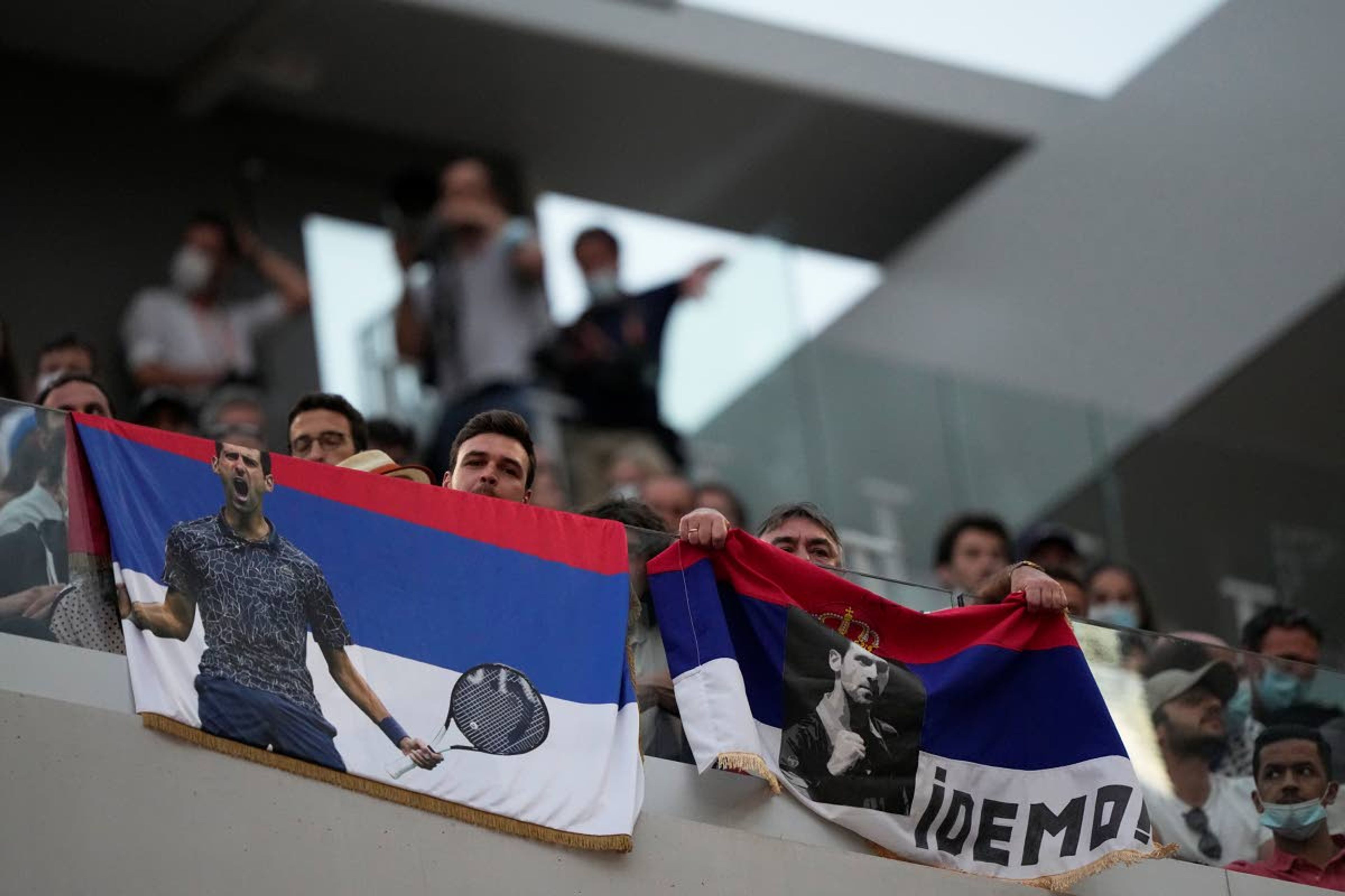 Tennis lovers support Serbia's Novak Djokovic playing Italy's Matteo Berrettini during their quarterfinal match of the French Open tennis tournament at the Roland Garros stadium Wednesday, June 9, 2021 in Paris. (AP Photo/Michel Euler)