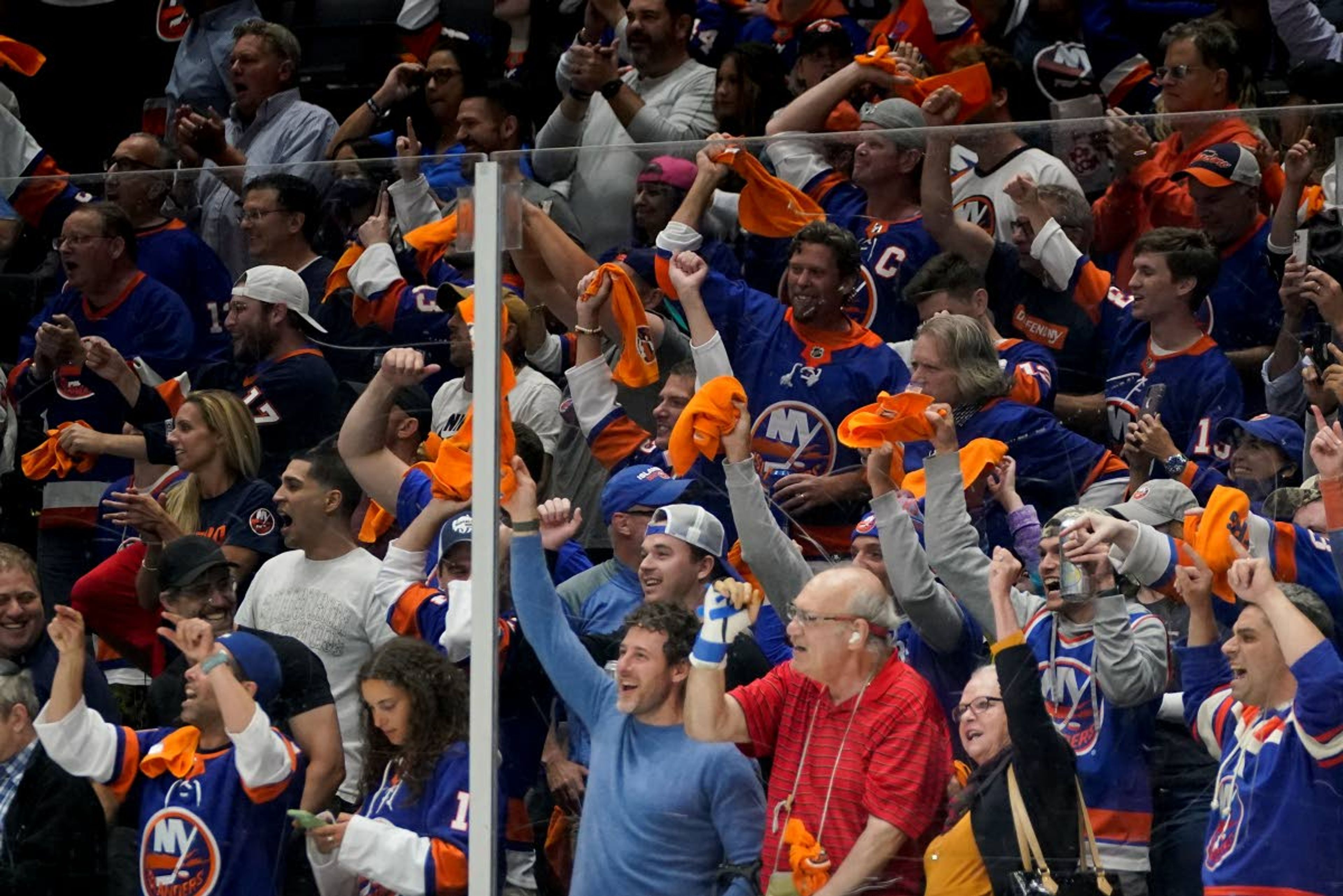 New York Islanders fans cheer during Game 6 of the NHL hockey Stanley Cup semifinals between the New York Islanders and the Tampa Bay Lightning, Wednesday, June 23, 2021, in Uniondale, N.Y. (AP Photo/Frank Franklin II)