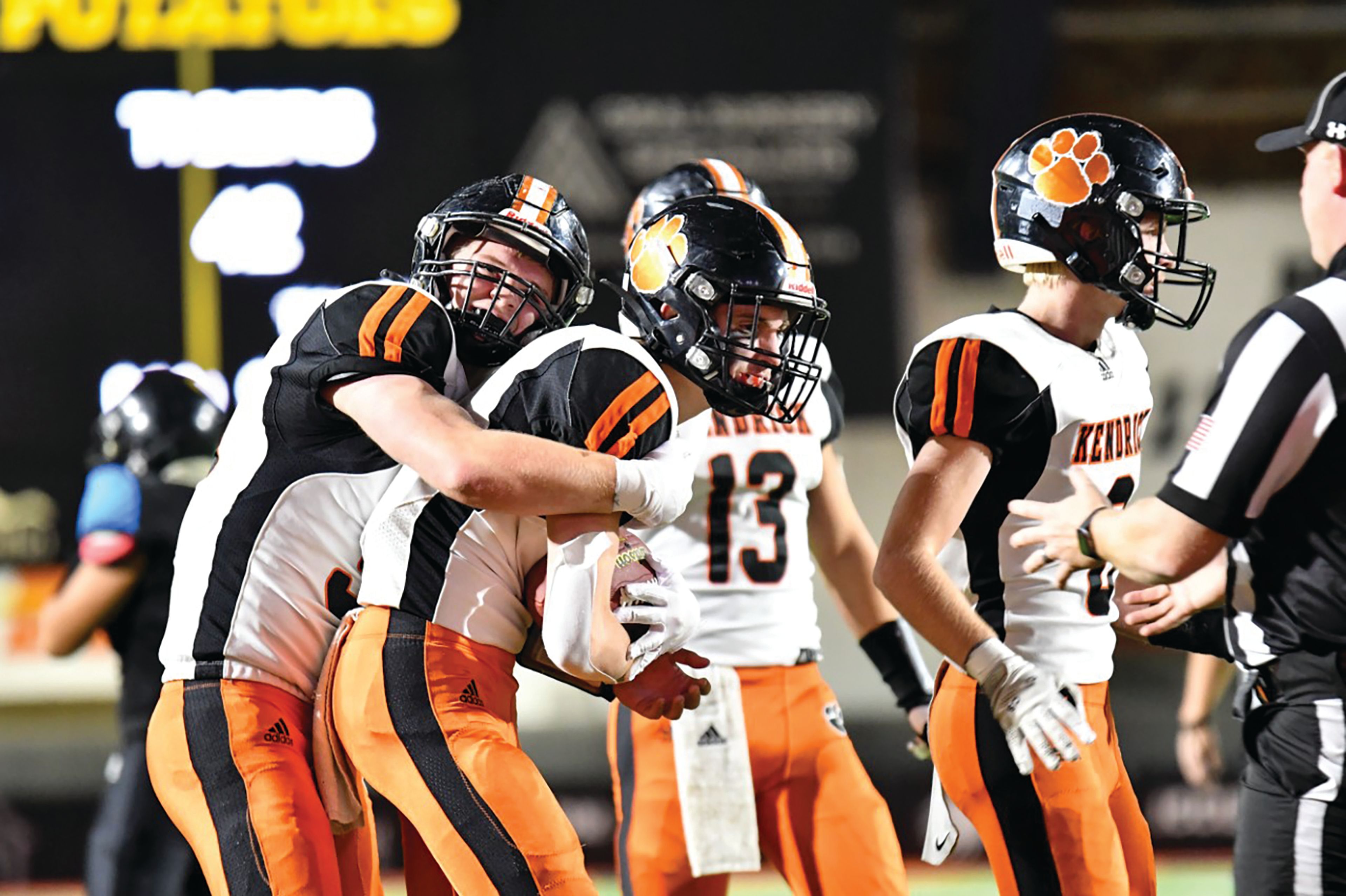 Scott Kirtley/For The Tribune Kendrick freshman linebacker Nate Tweit is congratulated by a teammate after picking off a pass late in the fourth quarter of Friday's Idaho Class 1A Division II football state championship game against Dietrich at Holt Arena in Pocatello.