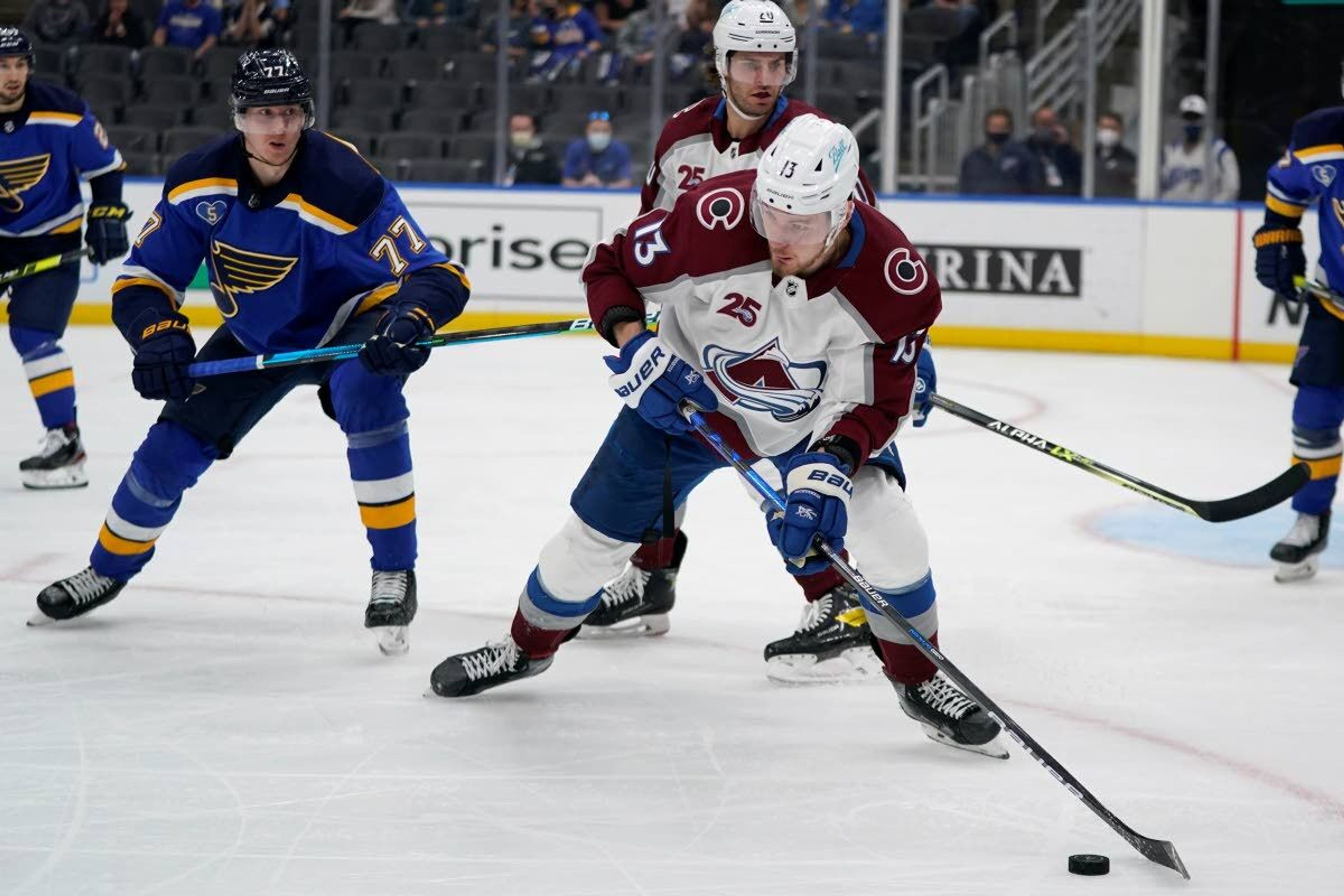 Colorado Avalanche's Valeri Nichushkin (13) controls the puck as St. Louis Blues' Niko Mikkola (77) defends during the third period in Game 4 of an NHL hockey Stanley Cup first-round playoff series Sunday, May 23, 2021, in St. Louis. (AP Photo/Jeff Roberson)